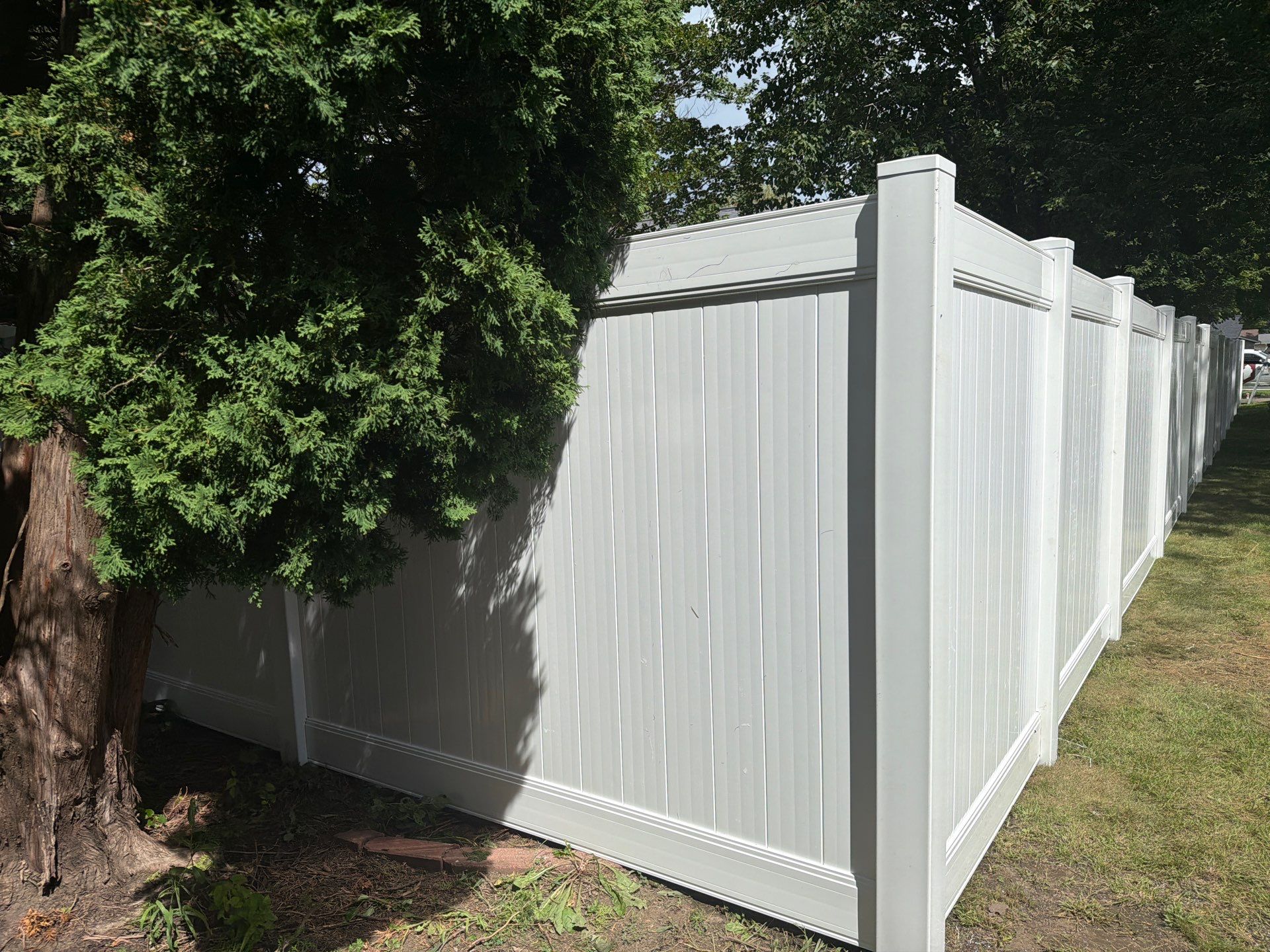 Residential White Vinyl Privacy and Black Chain Link Fencing in Jesup by Perfect Picket Fence and Stain