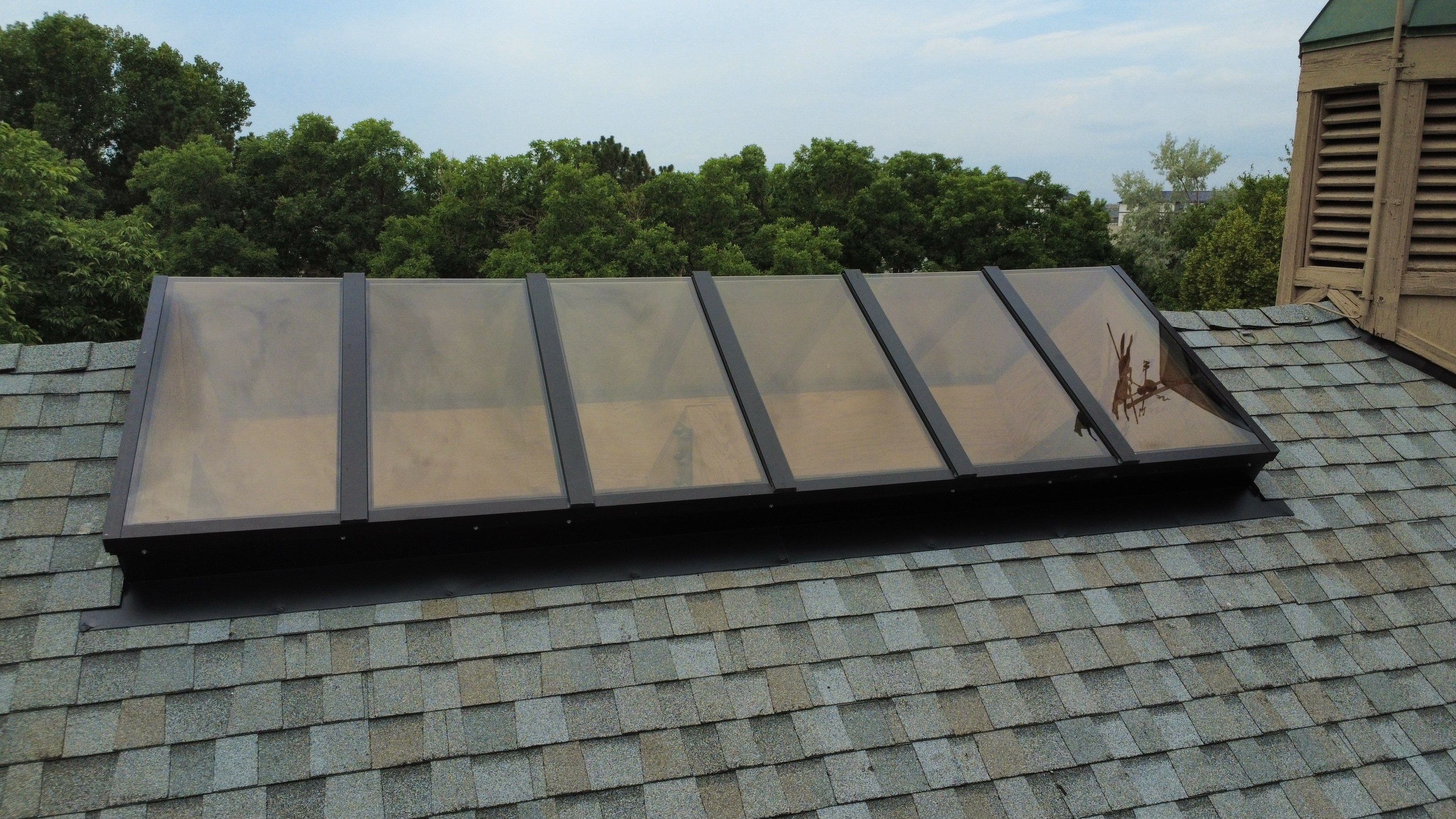 Asphalt Shingle and Skylight Replacement Project in Denver, CO by Blue Peaks Roofing LLC 