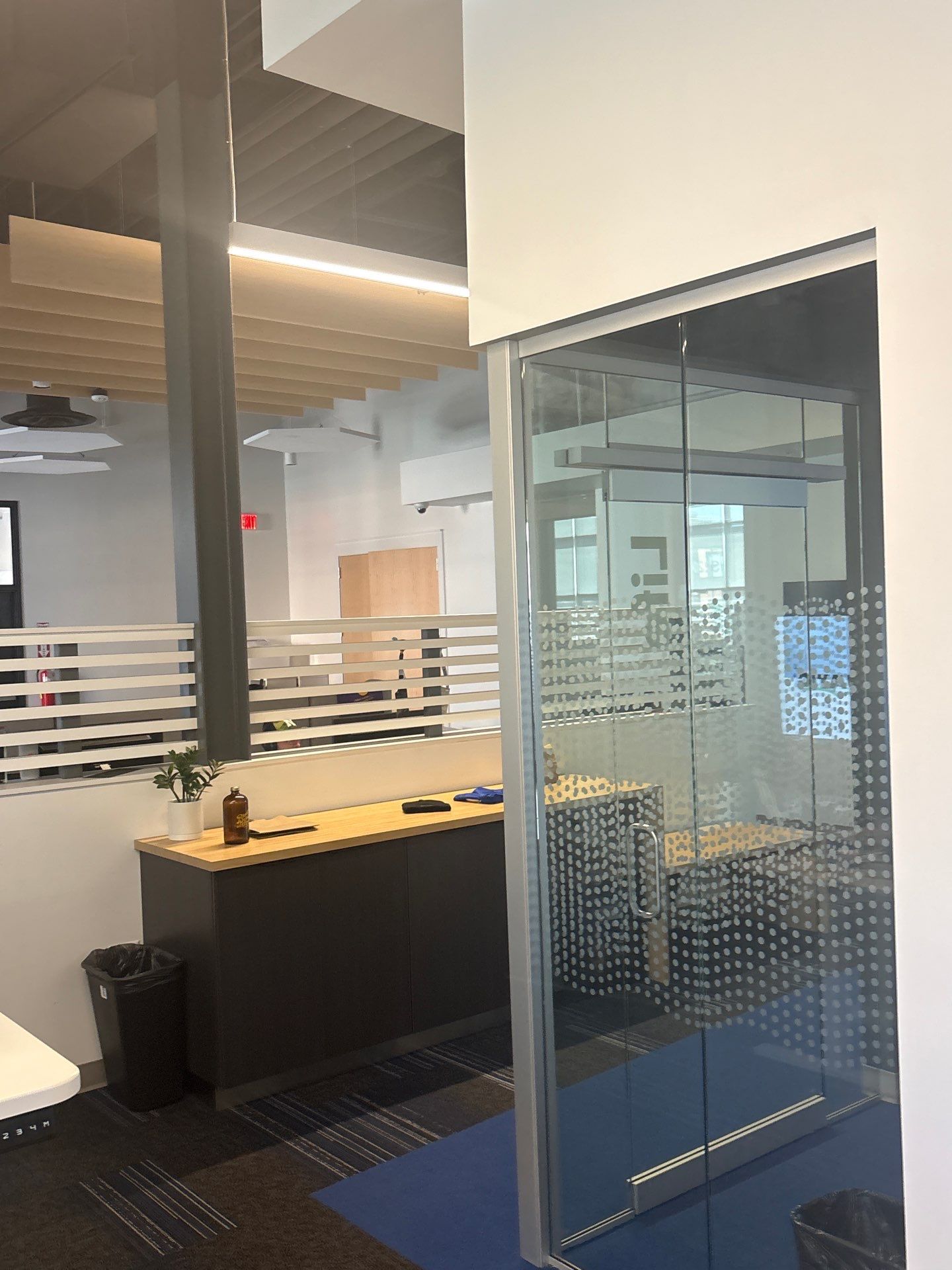 Lincoln Office Interior Remodel with Acoustic Baffles and Glass Walls by CompanyCam Sales Demo