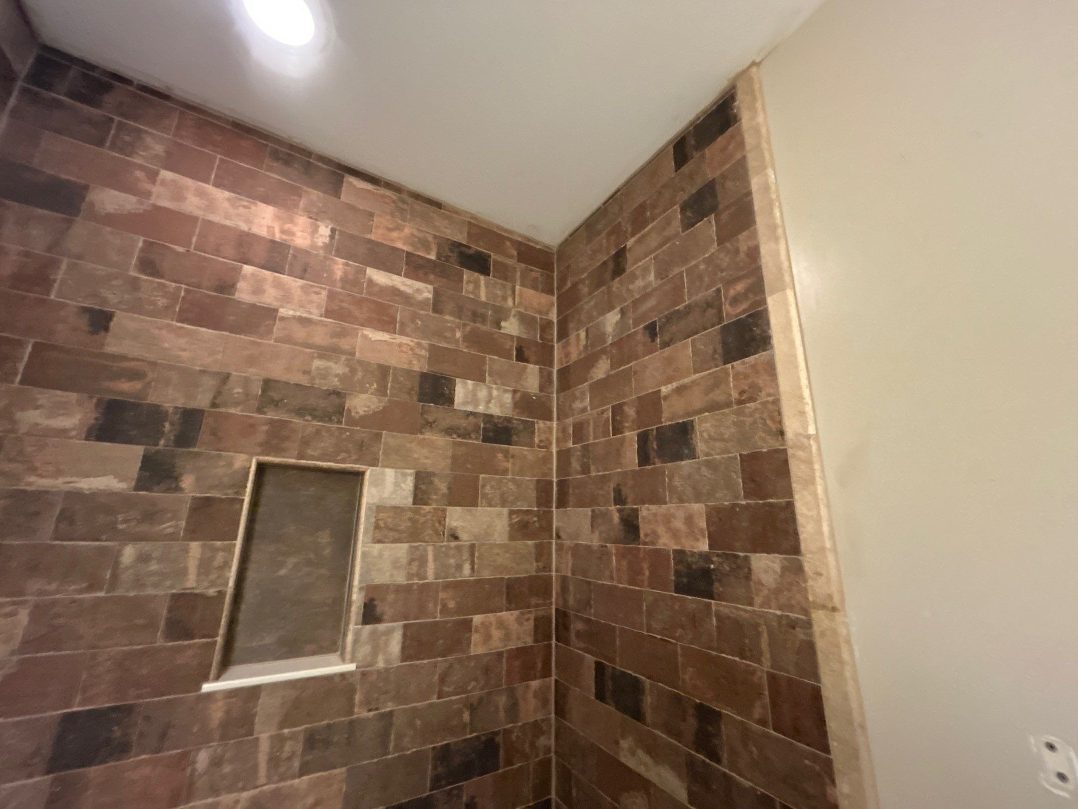 Tub Surround and Bathroom Floor by Footprints Floors Kentucky