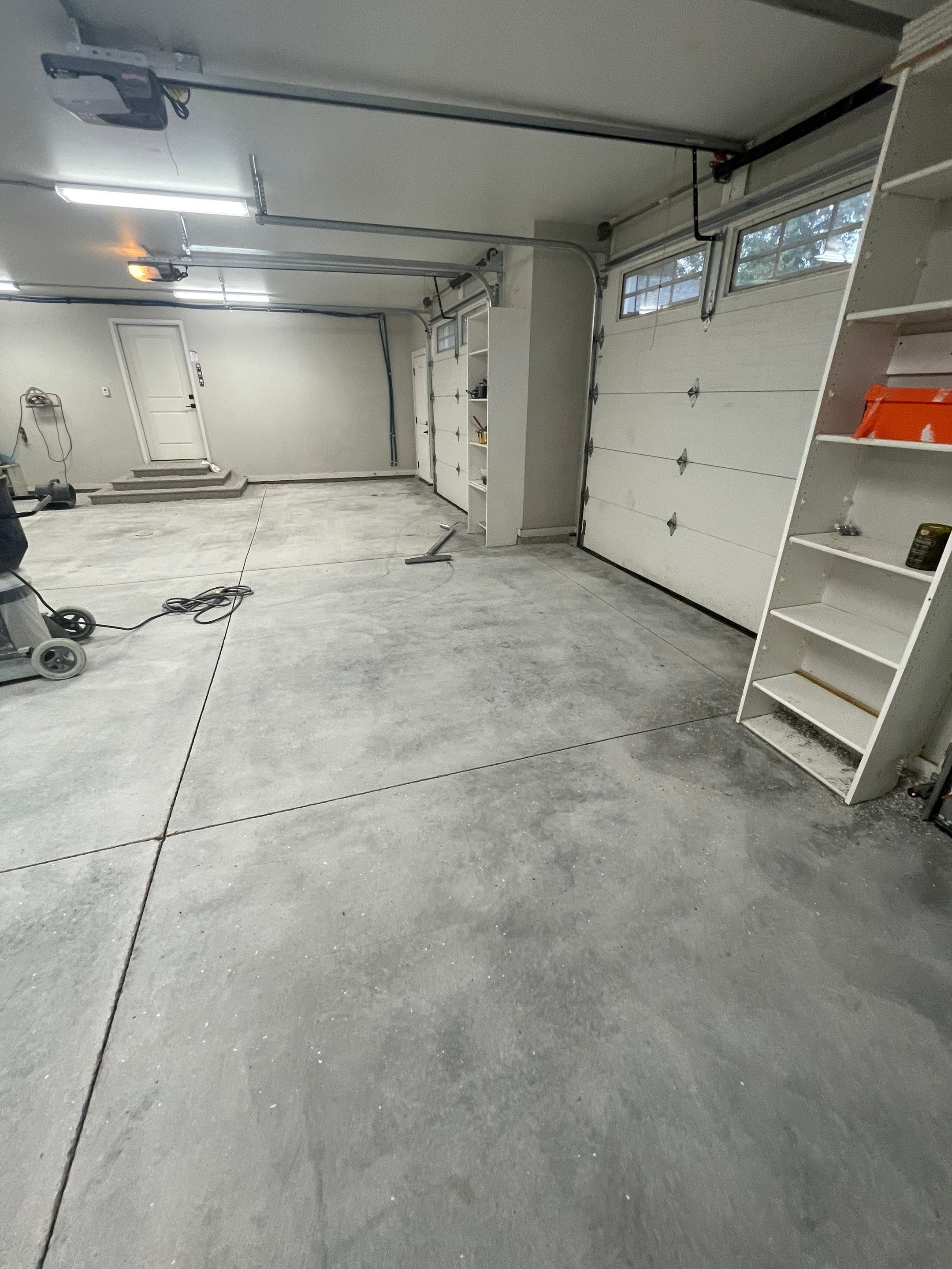 Grey Speckled Polyuera Garage Floor Coating for Hartford Three-Car Garage by Select Painting, Coatings & Garage Cabinets