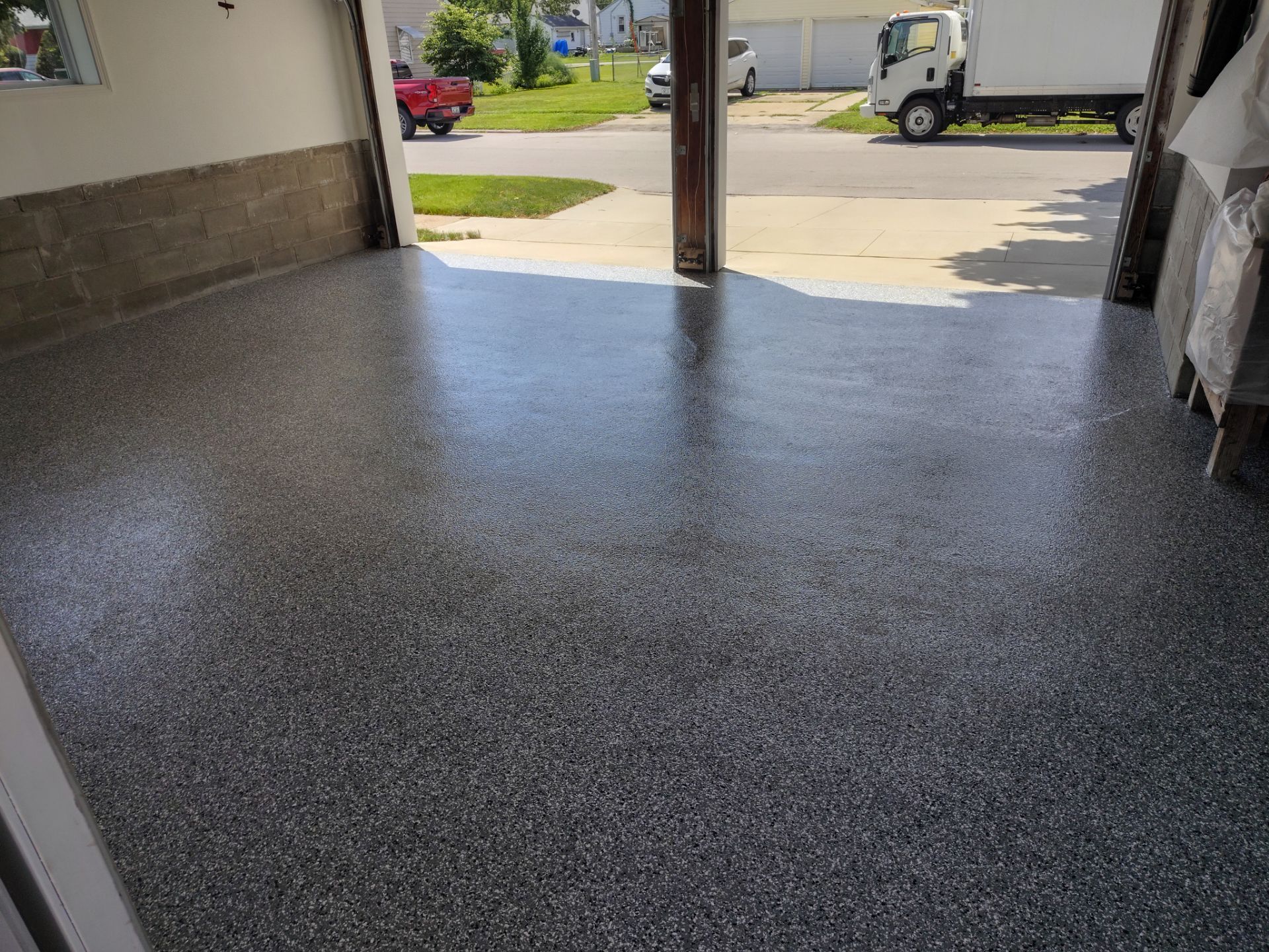 Wombat Flake Garage Floor Coating in Perry, IA by Revival Concrete Coatings
