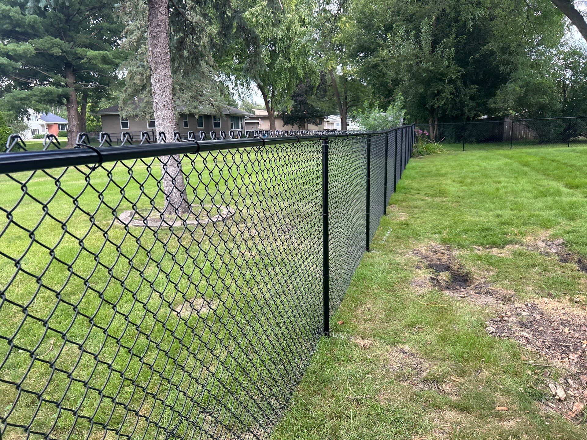 Black Vinyl Coated Chain Link Fence Installation in Waterloo by Perfect Picket Fence and Stain