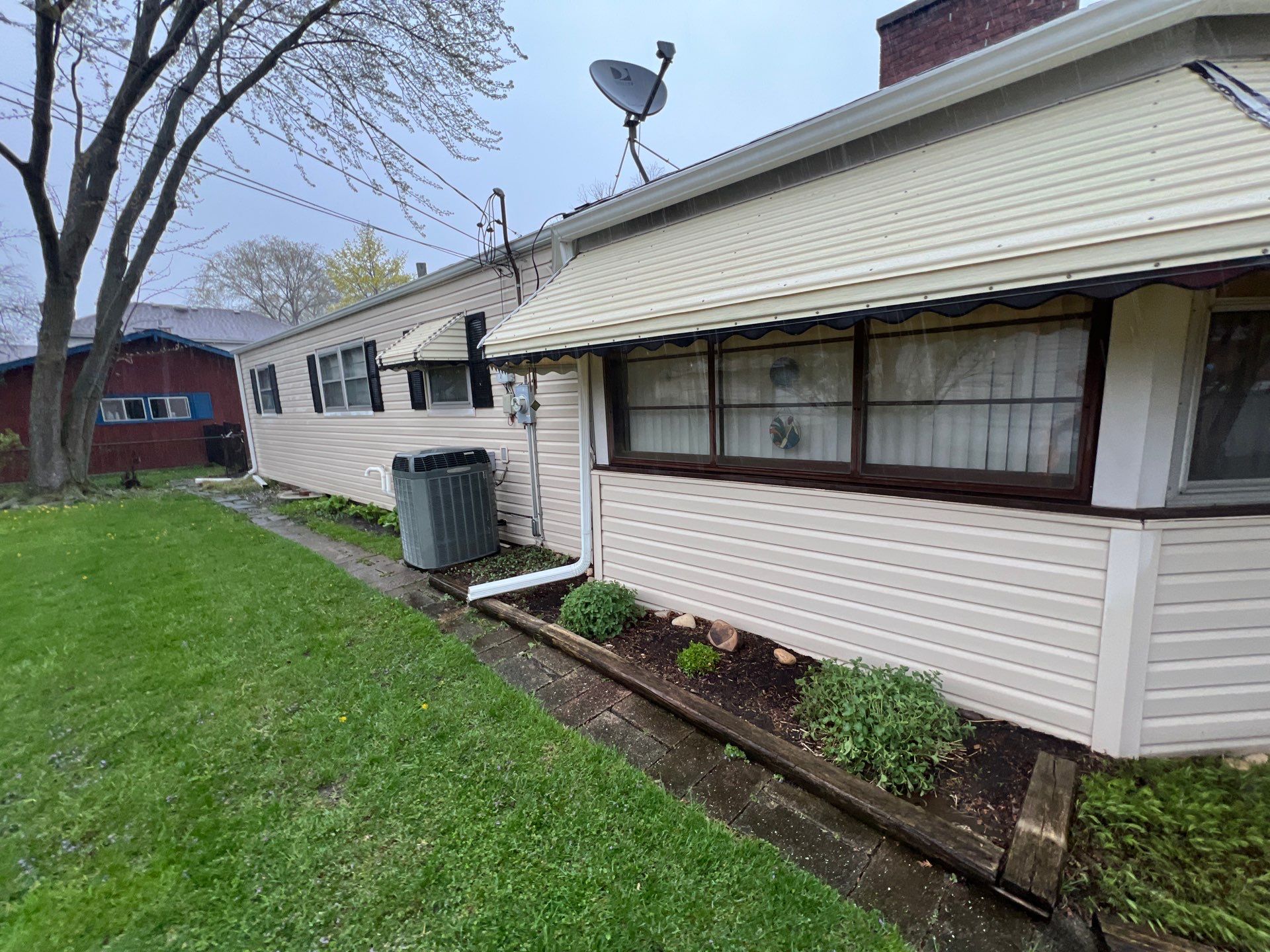 Housewashing  using Algaecide, soft wash soap by Northern Power Washing LLC.