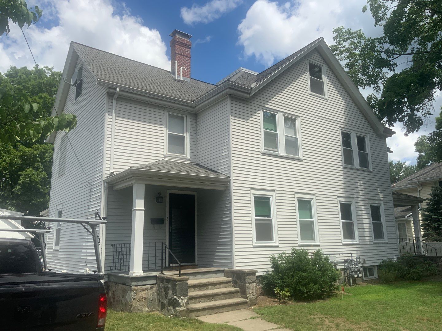Vinyl siding layover project for 2 family in Wellesley, MA by UBrothers Construction