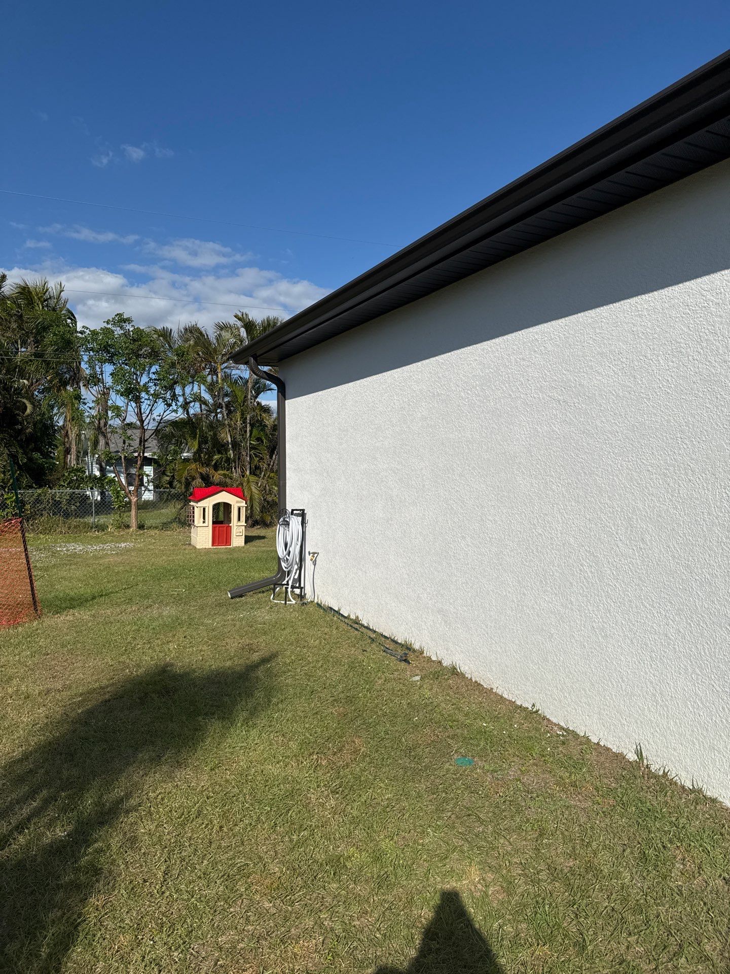 Dark Seamless Gutters and Downspouts in Cape Coral FL by Gutter Professors