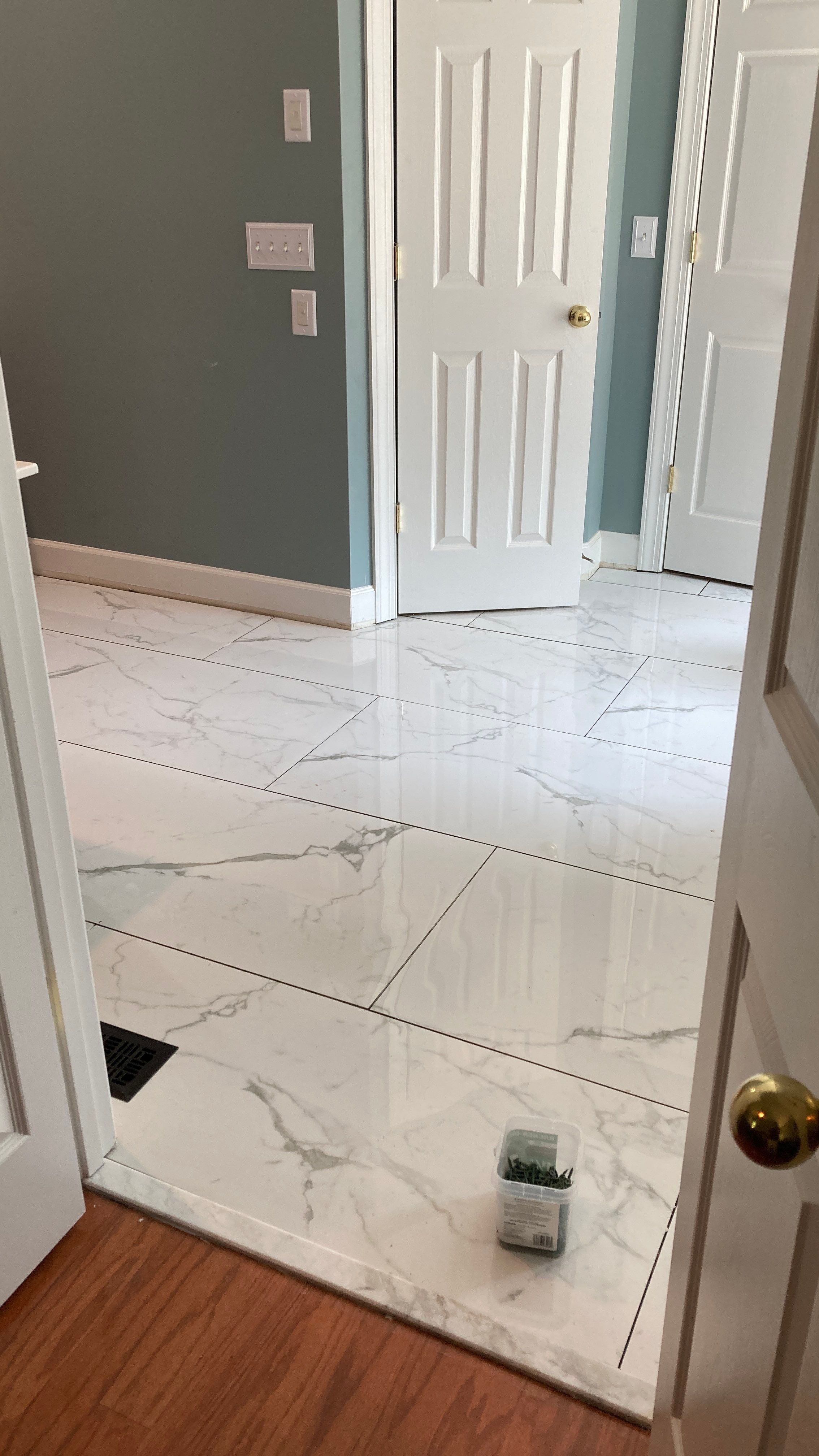Lovely marbled bathroom floor  by Footprints Floors of Nashville