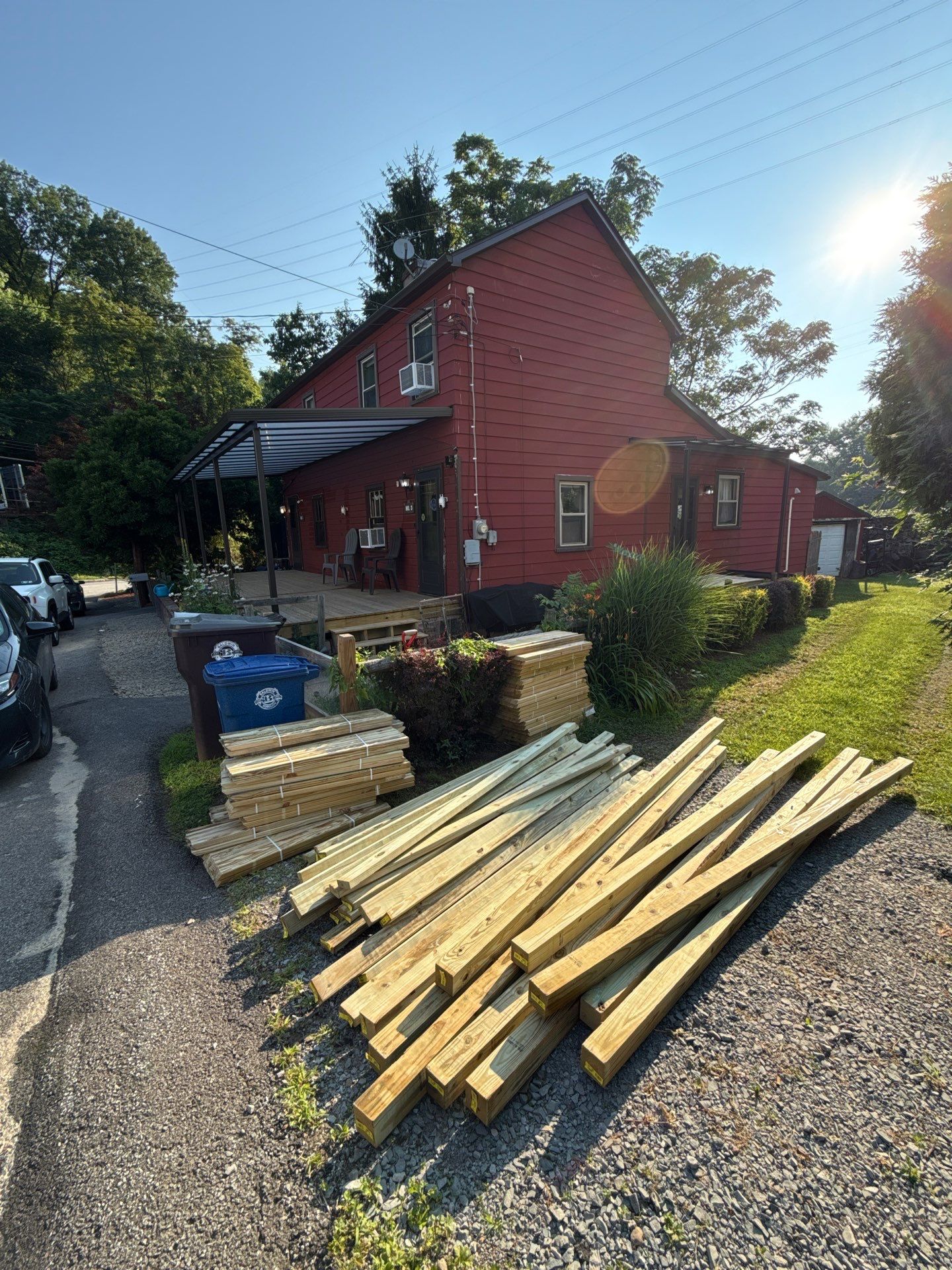 Roof sunspace deck  by Cousins Roofing Siding & Decks