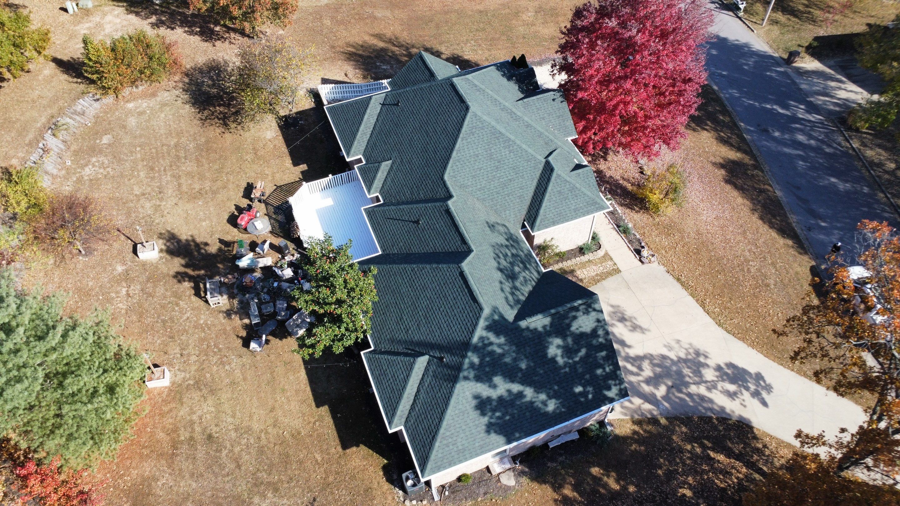 Residential Roofing Install - Green Atlas Pinnacle Pristine Shingles - White Gutters & Downspouts  by Titan Commercial & Residential Roofing 
