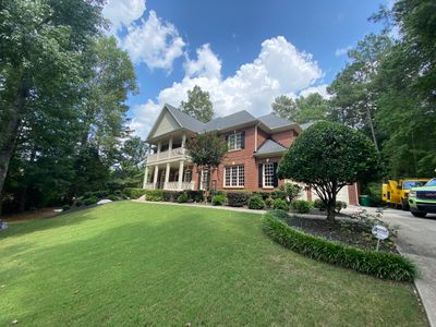 Exterior Trim and Garage Door Painting for Alpharetta Brick Home