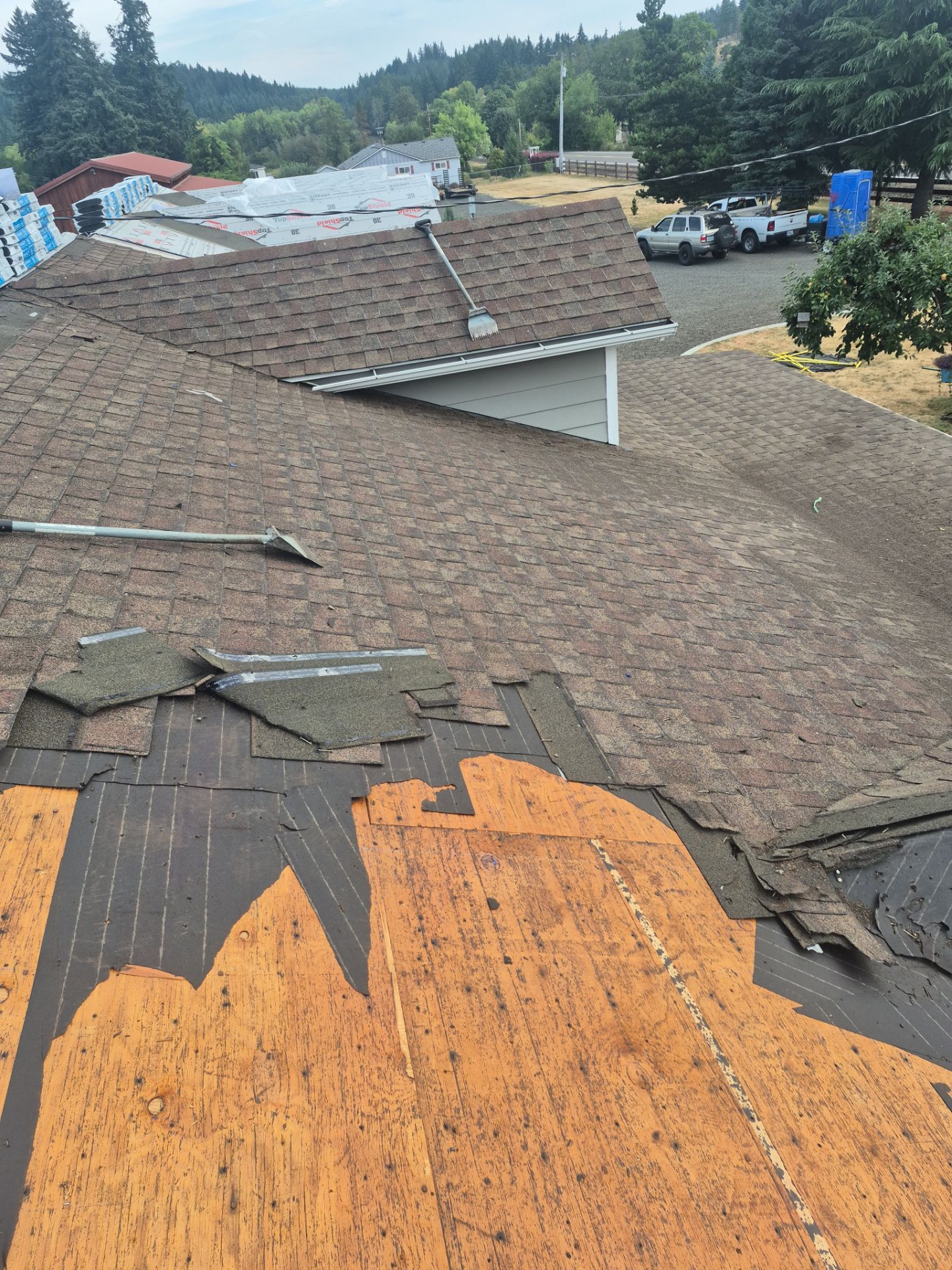 Residential Roof Replacement with Metal Accents by Orezona Building & Roofing Company, Inc.