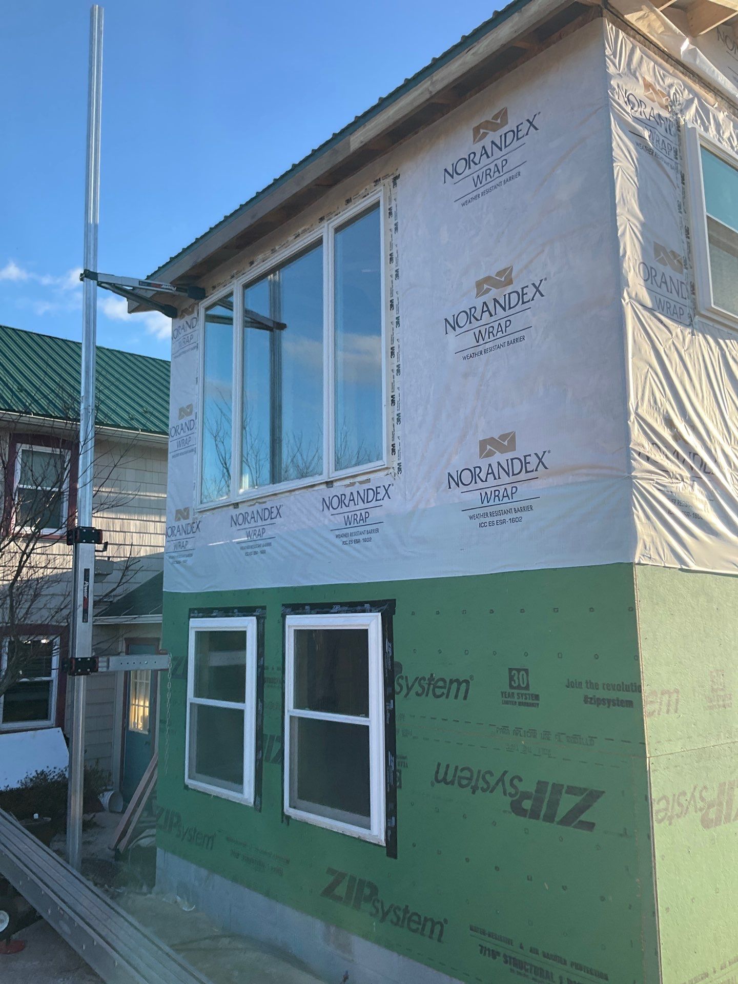 Multi-Story Residential Addition Featuring Textured Metal Siding in Millersburg by Esh Builders