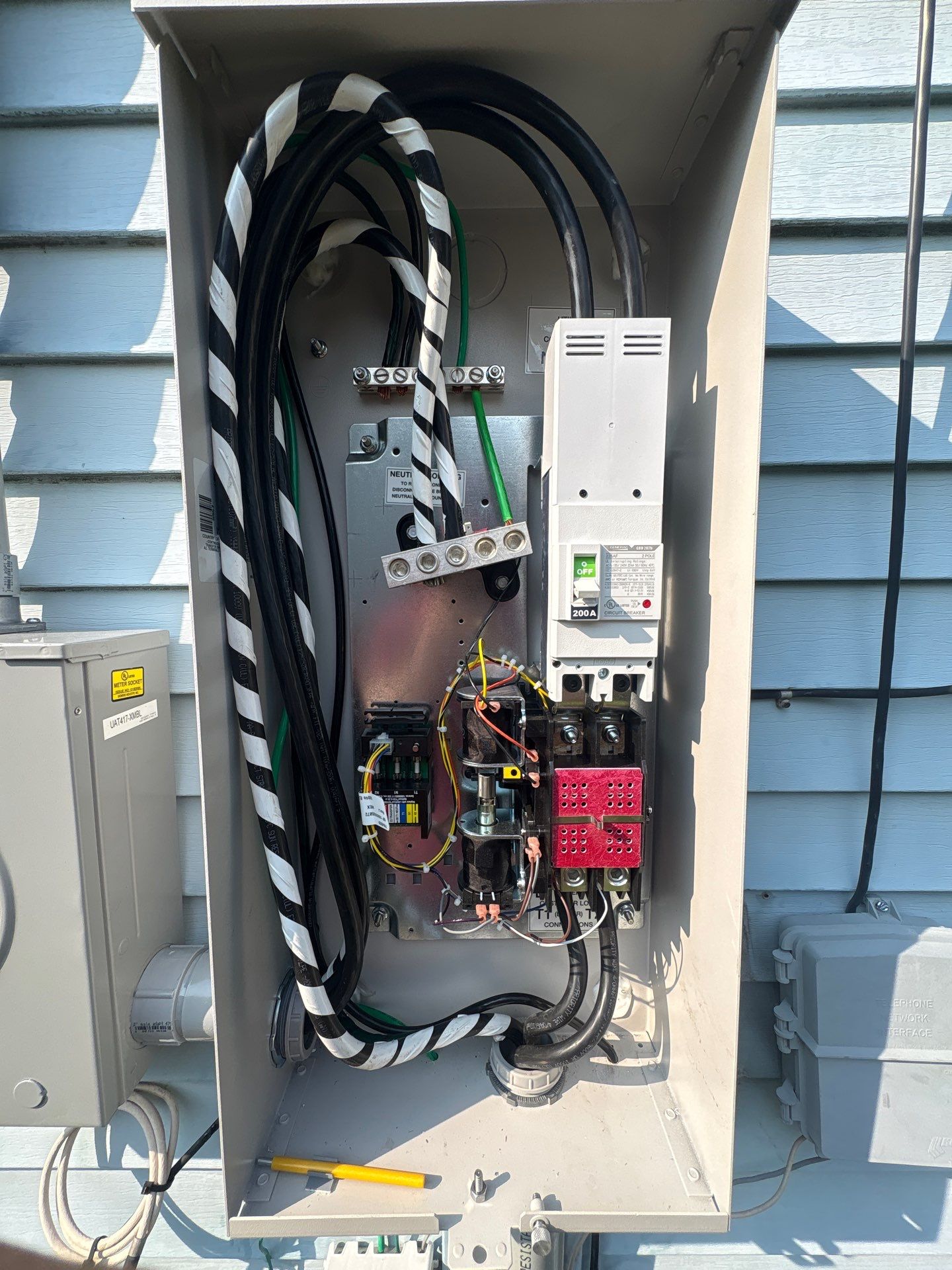 200A Panel with Generator Interlock Kit and Whole-Home Surge Protector by Spartan Home Pros