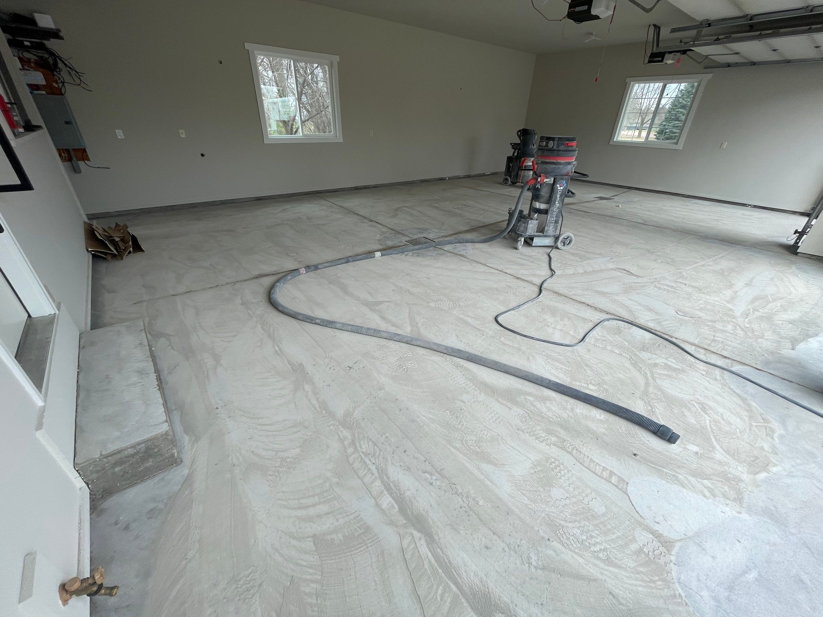 Garage transformation in Yankton by Select Painting, Coatings & Garage Cabinets