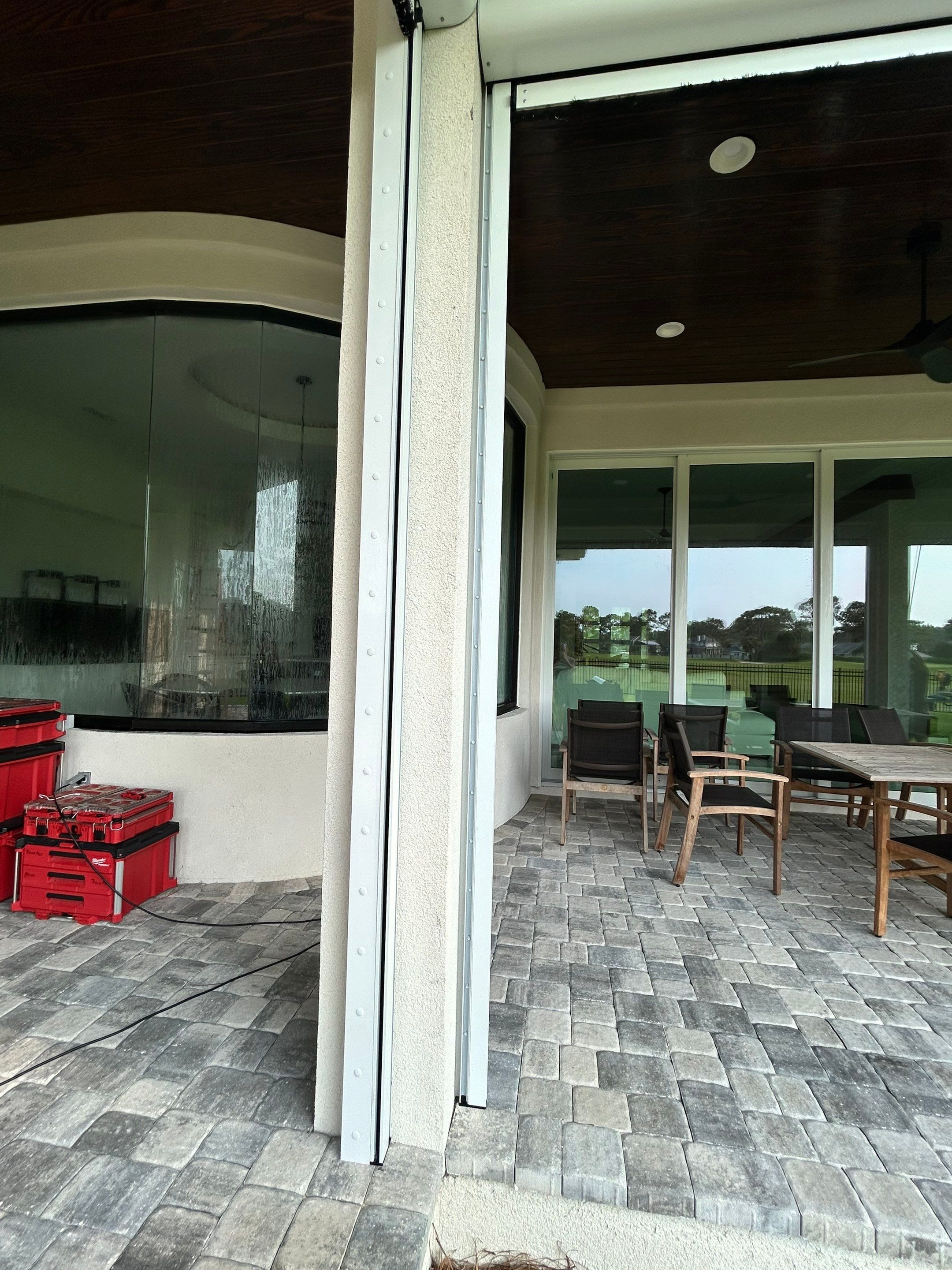 Motorized Screen and Solar Shade Installation in Panama City Beach by Brannan Aluminum Inc.