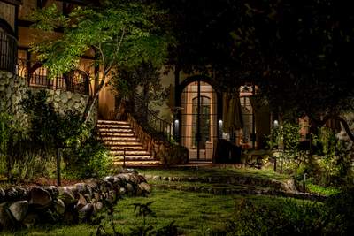 Tudor Estate Landscape Lighting with Integrated Stone Step Illumination