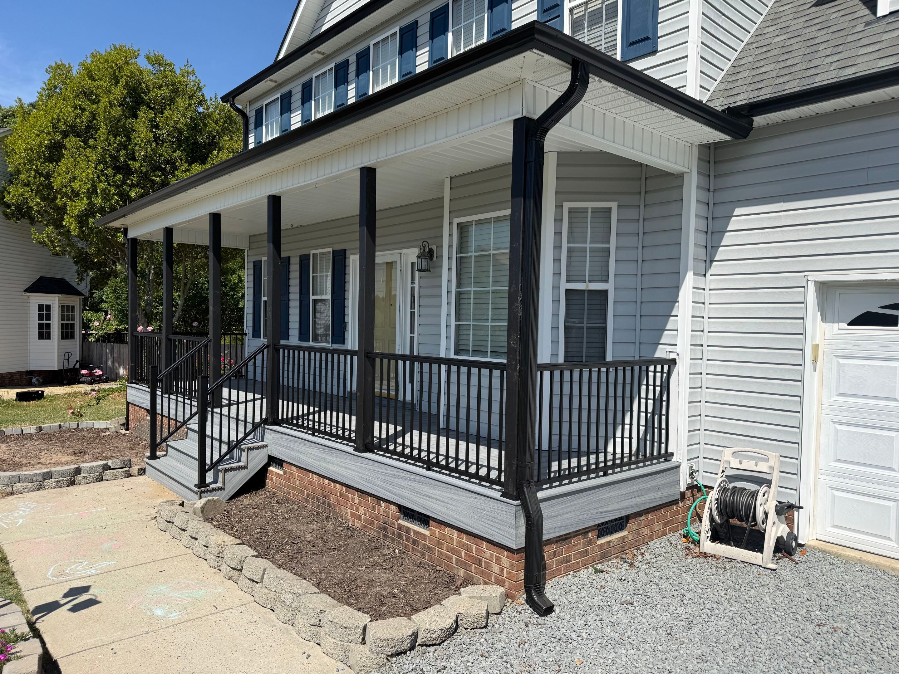 Willow Spring Composite Deck Resurface and Black Railing Upgrade by The Remodeling Company