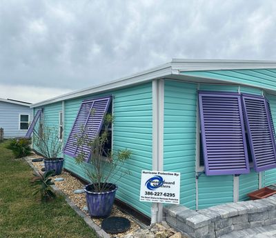 Hurricane Rated Bahama Shutters in Pearl Violet