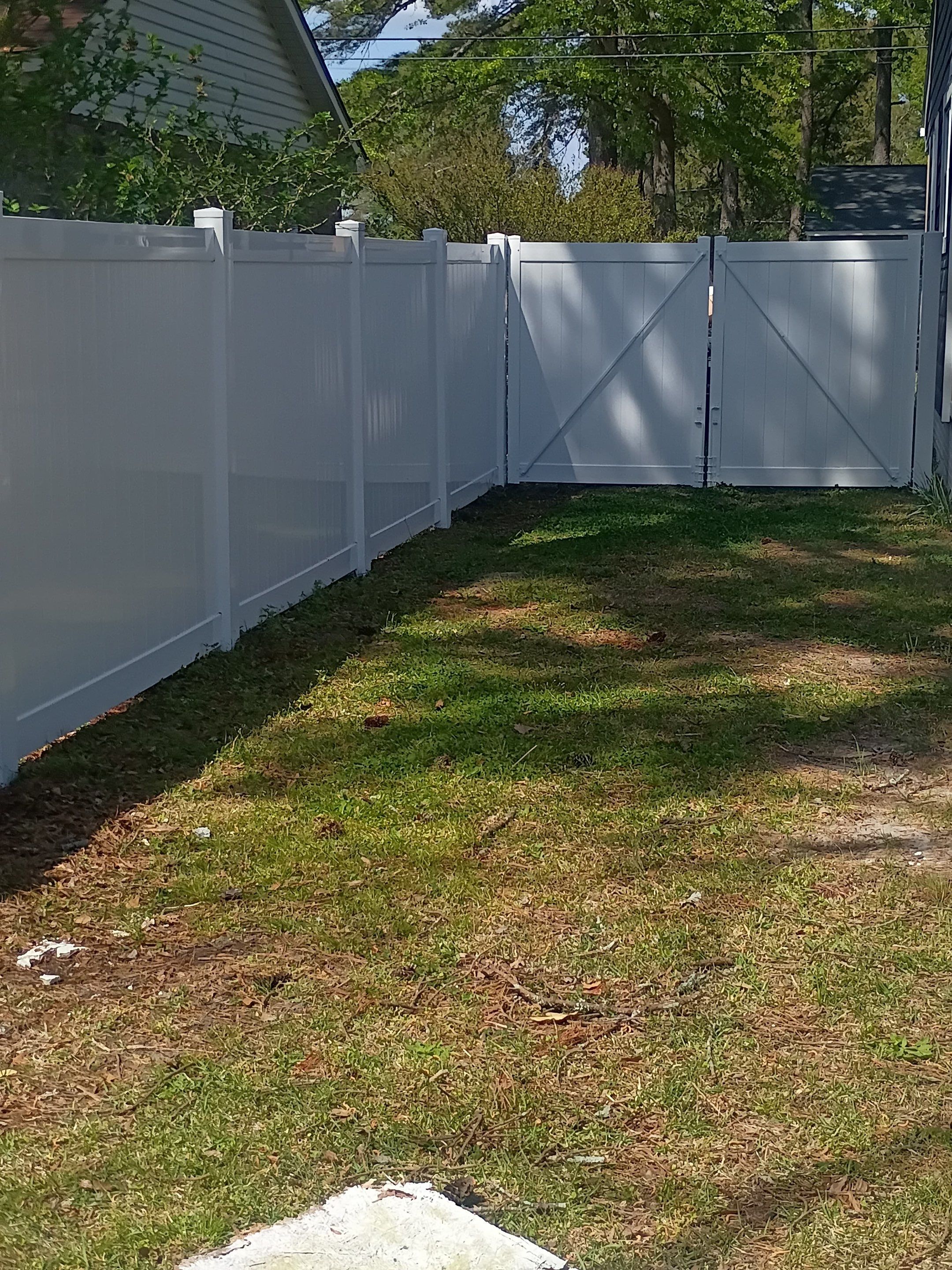 White Vinyl Privacy Fence Installation in Greenville, NC by Superior Fence and Rail