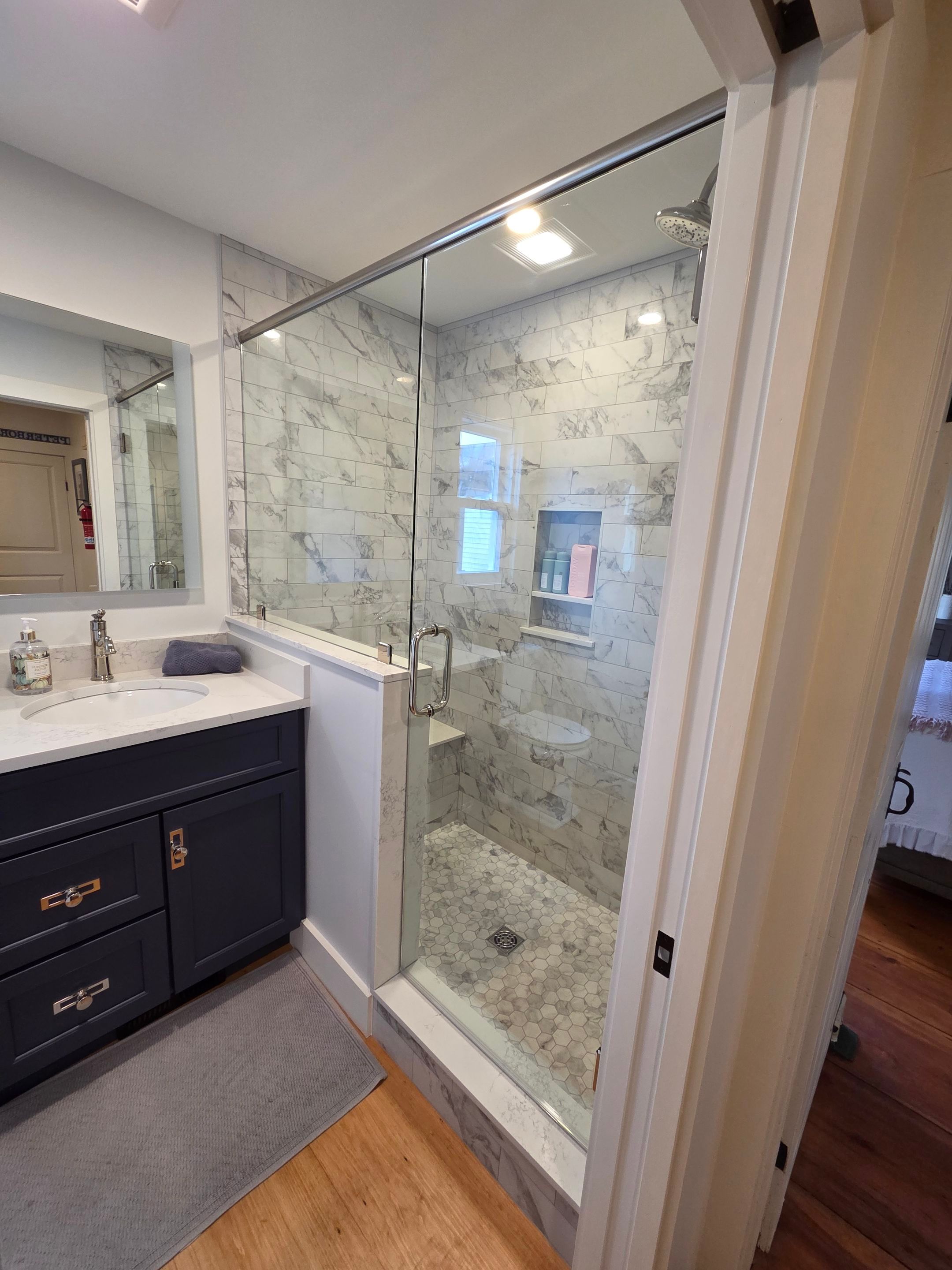 Frameless Shower Enclosure with Header Bar  by Cheshire Glass Company
