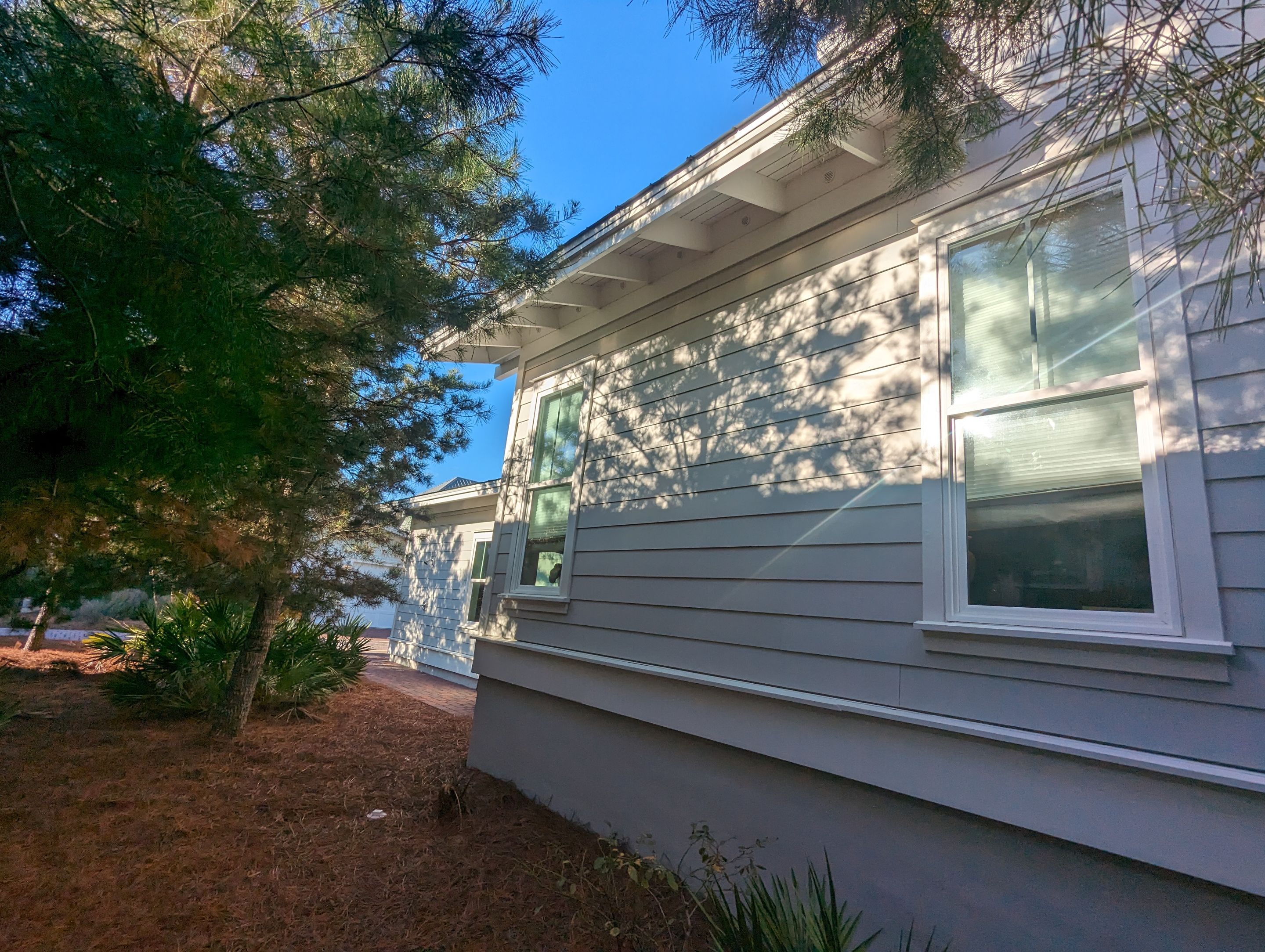 White Half-Round Gutters Installation in Rosemary Beach, FL by Gutter Professors