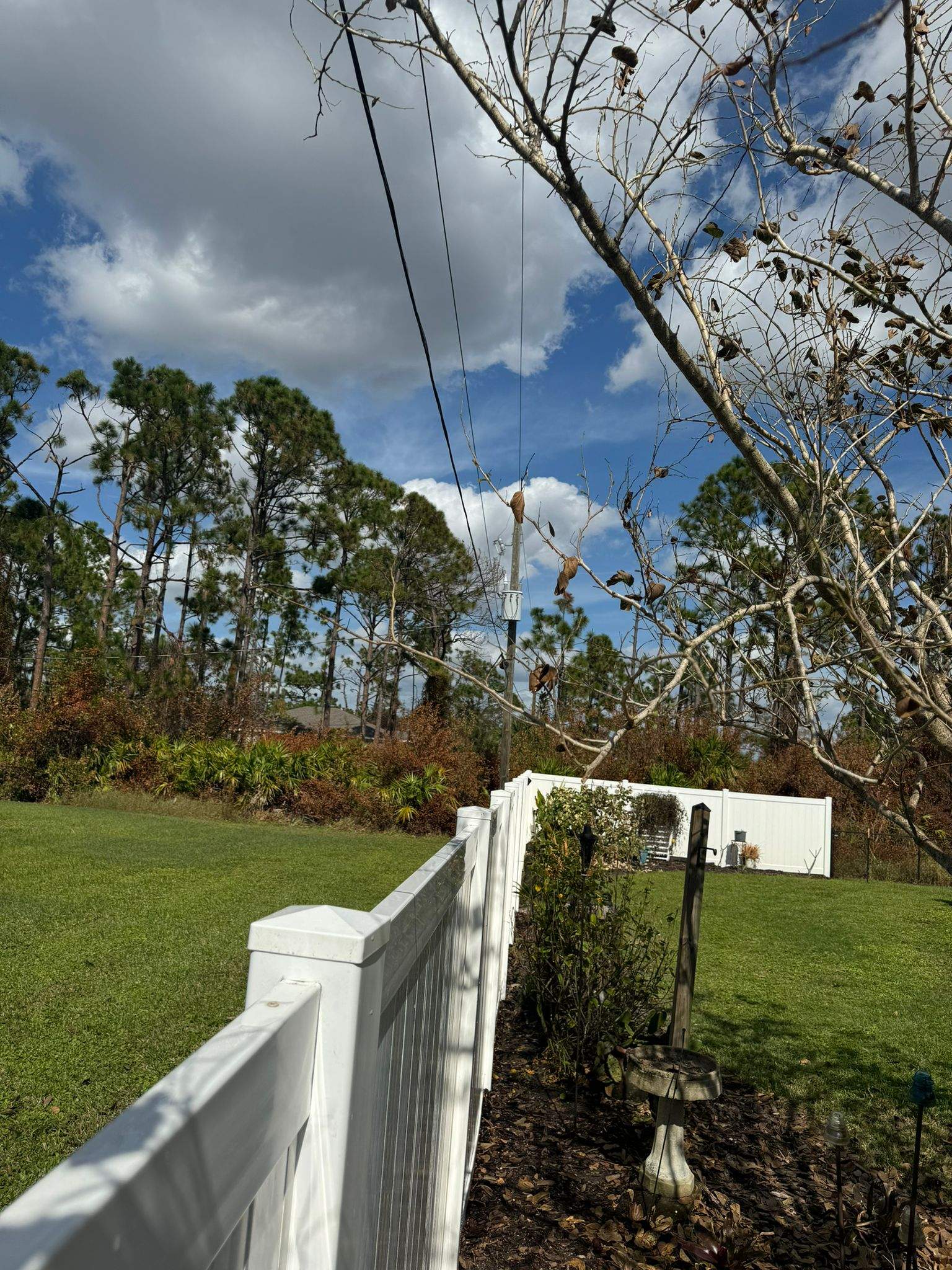 White Vinyl Privacy Fence Installation in Port Charlotte by True Fence LLC