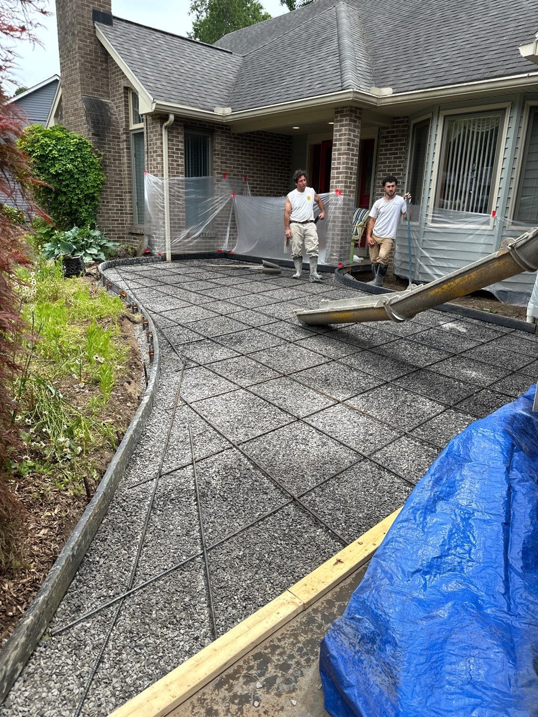 Heavy stone textured stamped concrete patio  by NG Masonry & Construction LLC