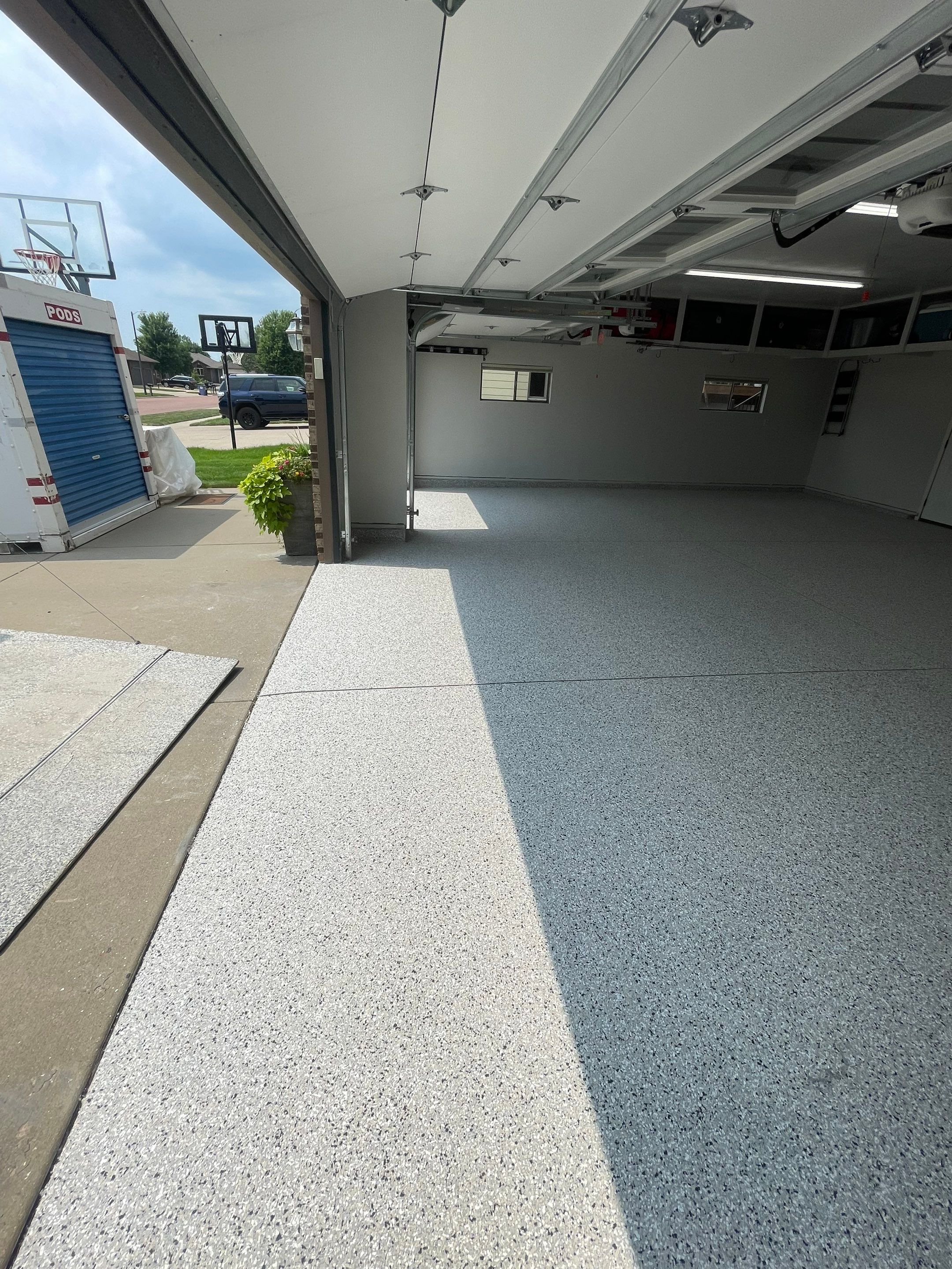 Multi-Car Garage Floor Coating and Crack Repair in Tea by Select Painting, Coatings & Garage Cabinets