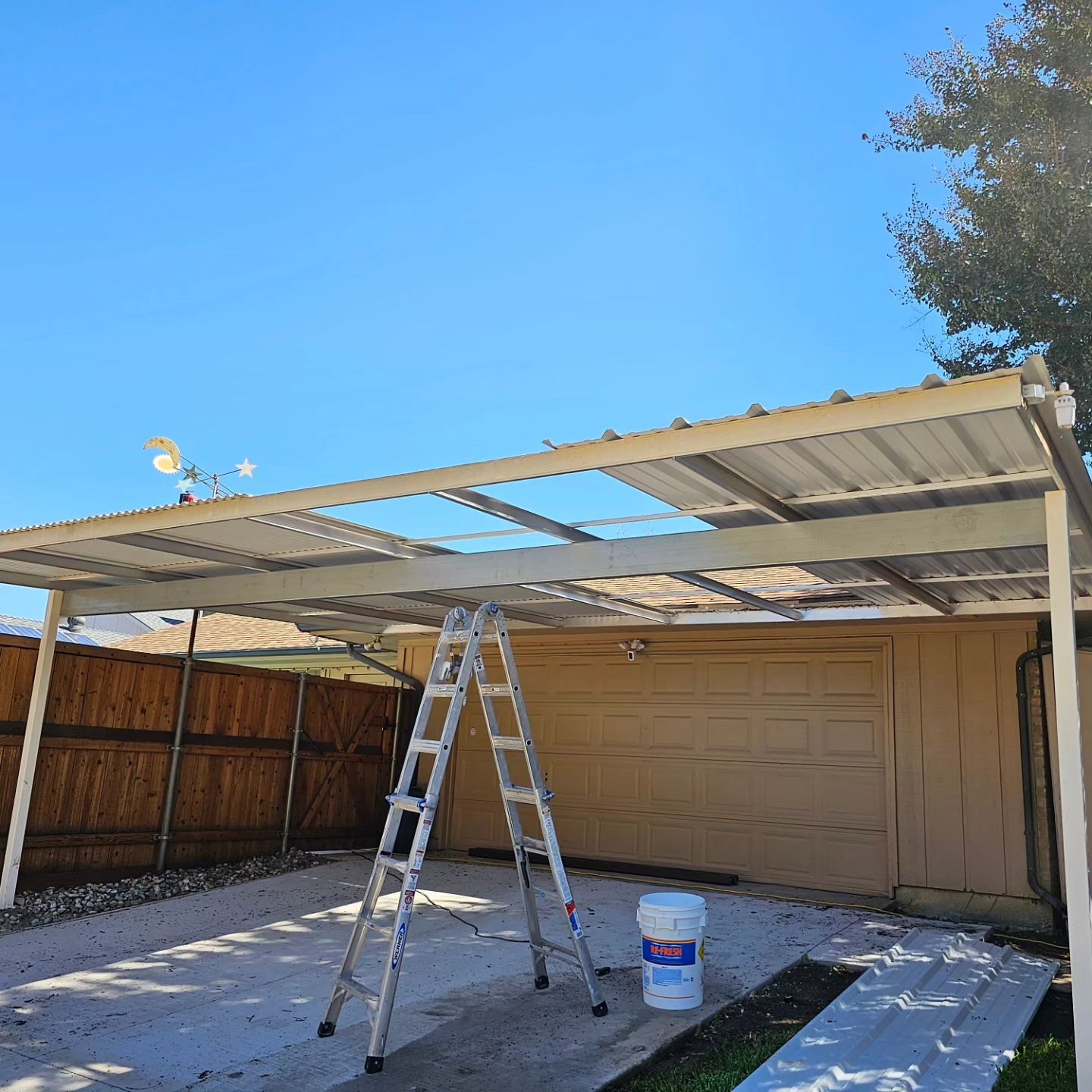 Carport & fence stain by EL-GC LLC 
