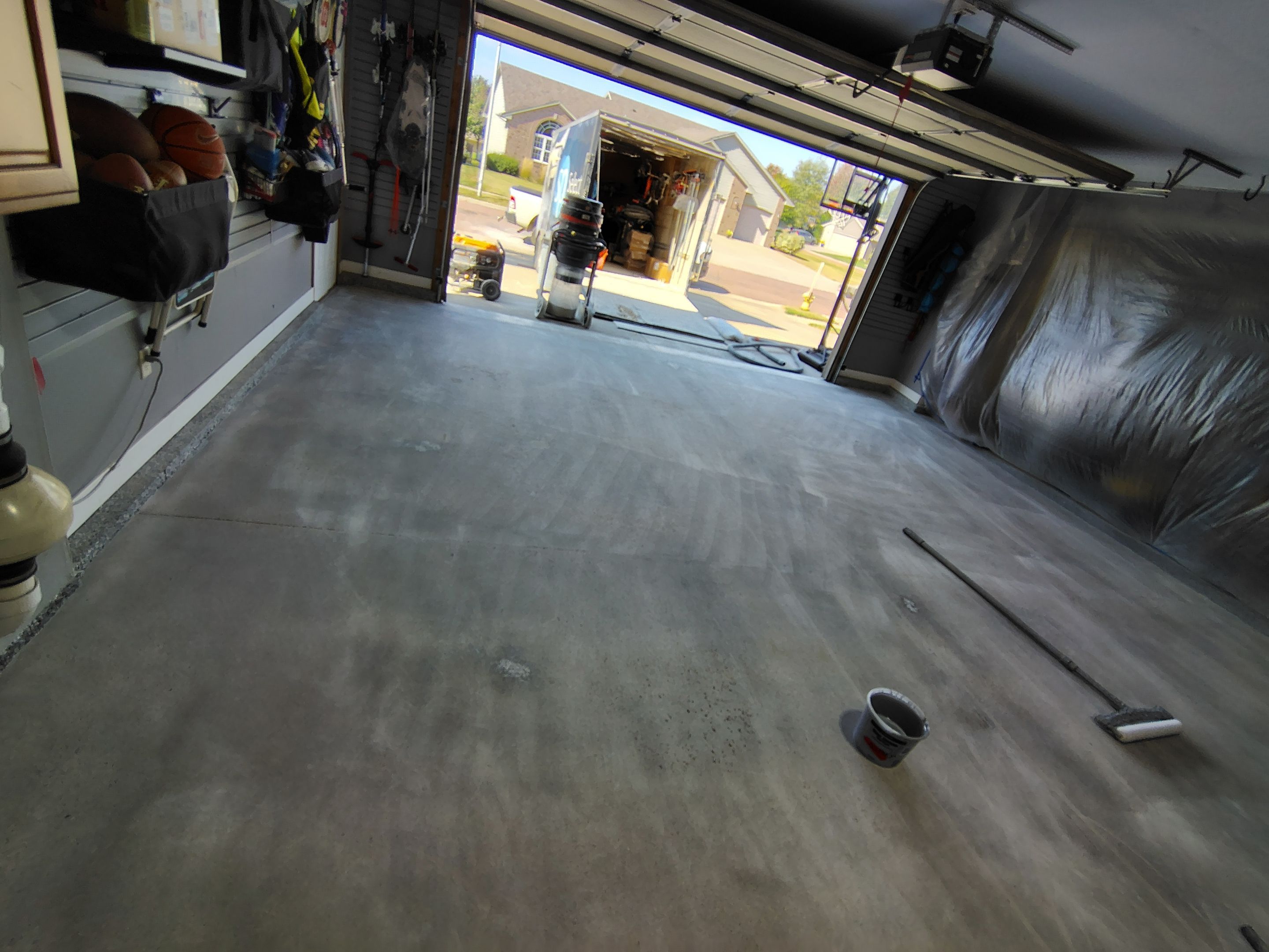 Grey Flecked Epoxy Garage Floor Installation in Sioux Falls by Select Painting, Coatings & Garage Cabinets