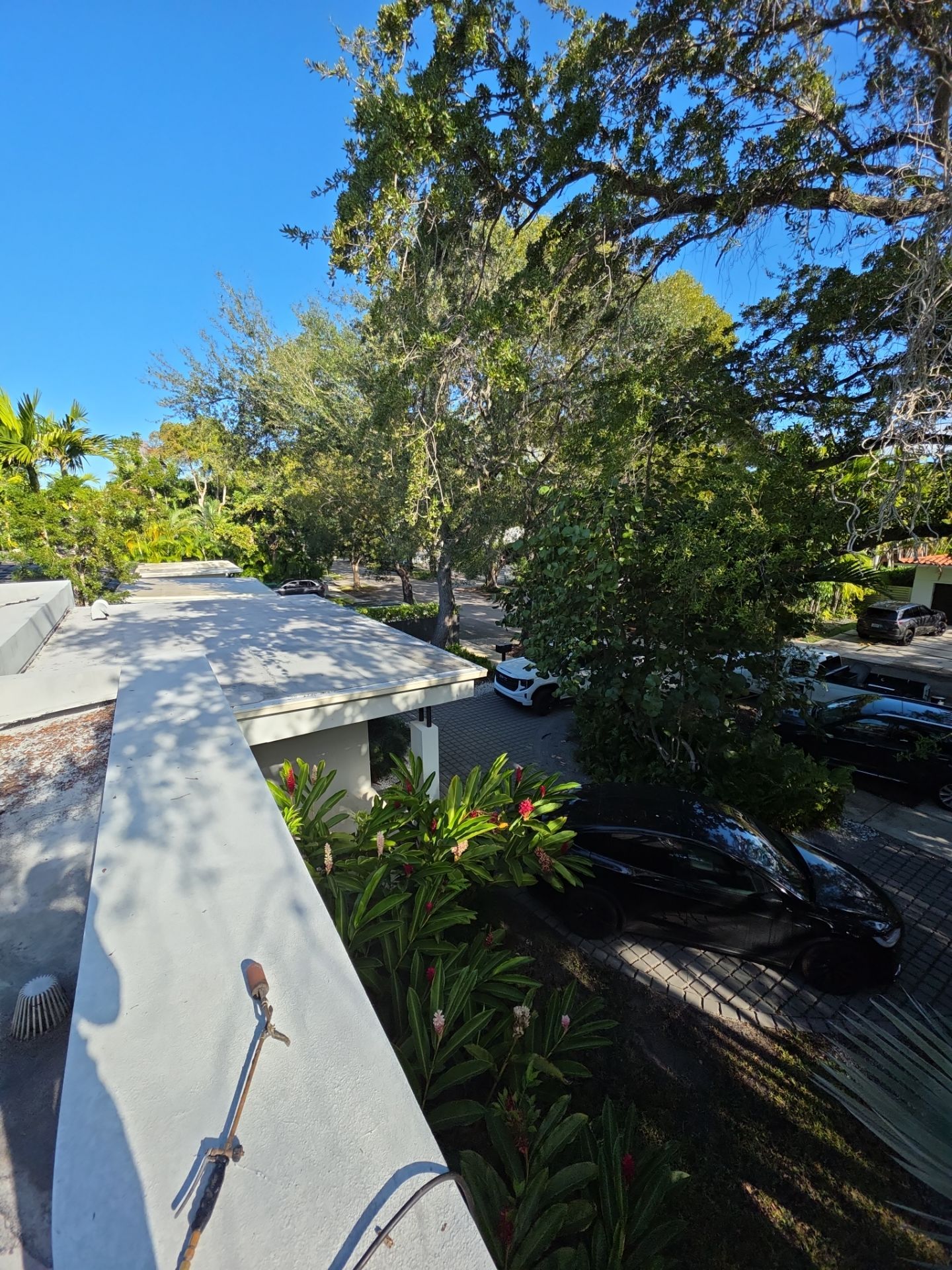 Flat Roof Silicone Coating and Interior Water Damage Restoration in Miami by Picos Construction Engineering