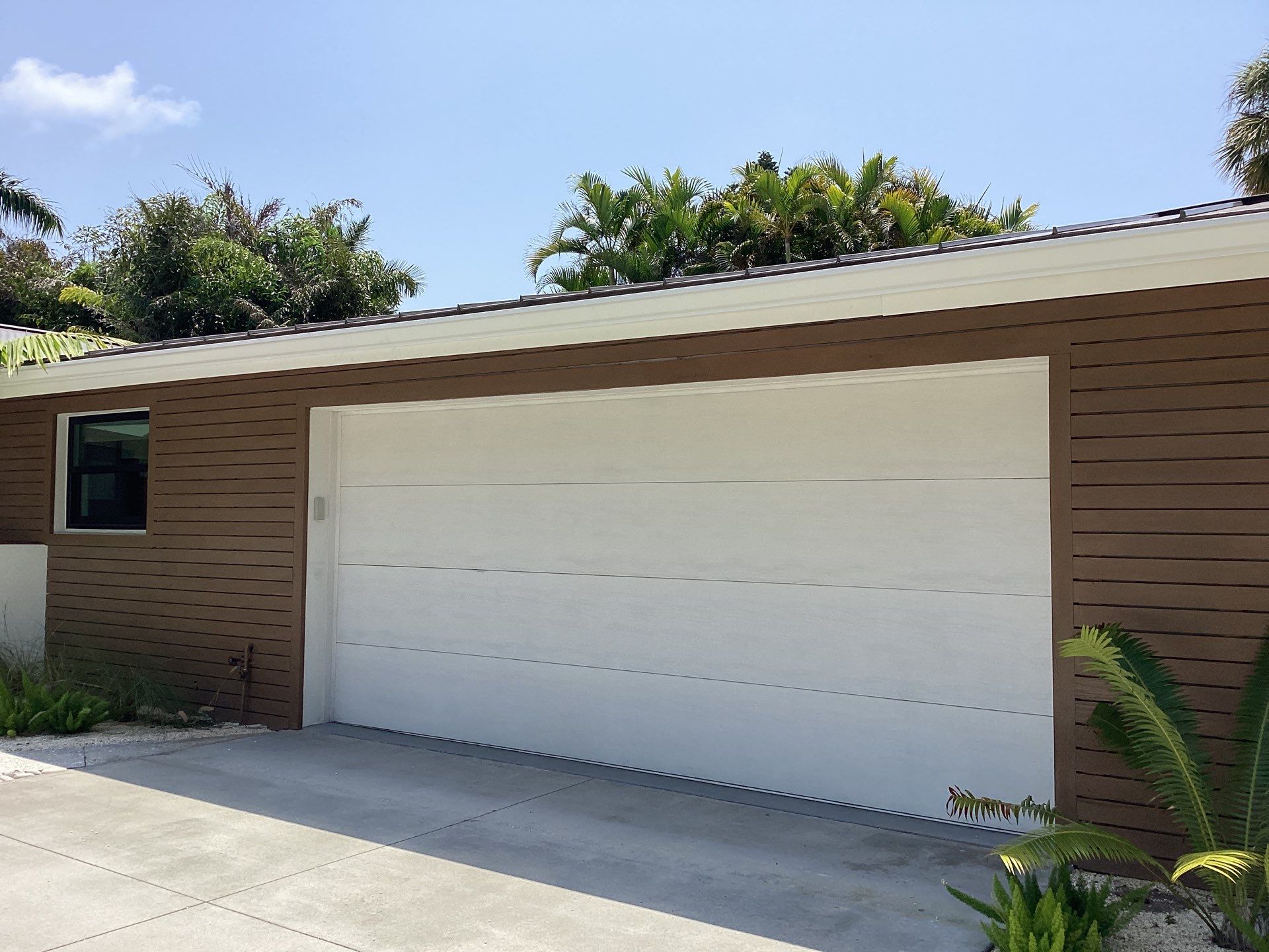 White Seamless Gutters and Downspouts in Sarasota FL by Gutter Professors