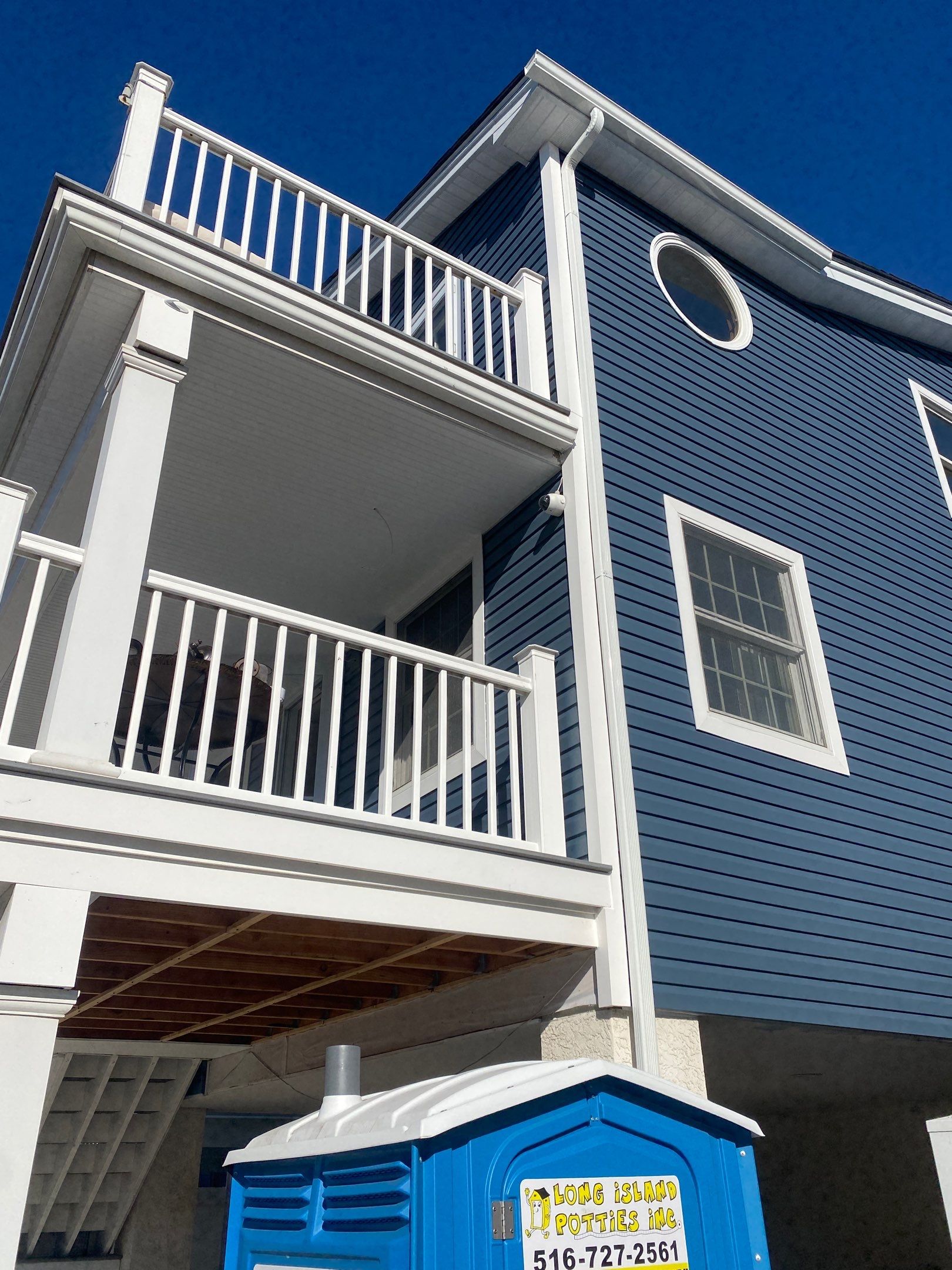 House lift in the westend of Long Beach. by Above All Gutters