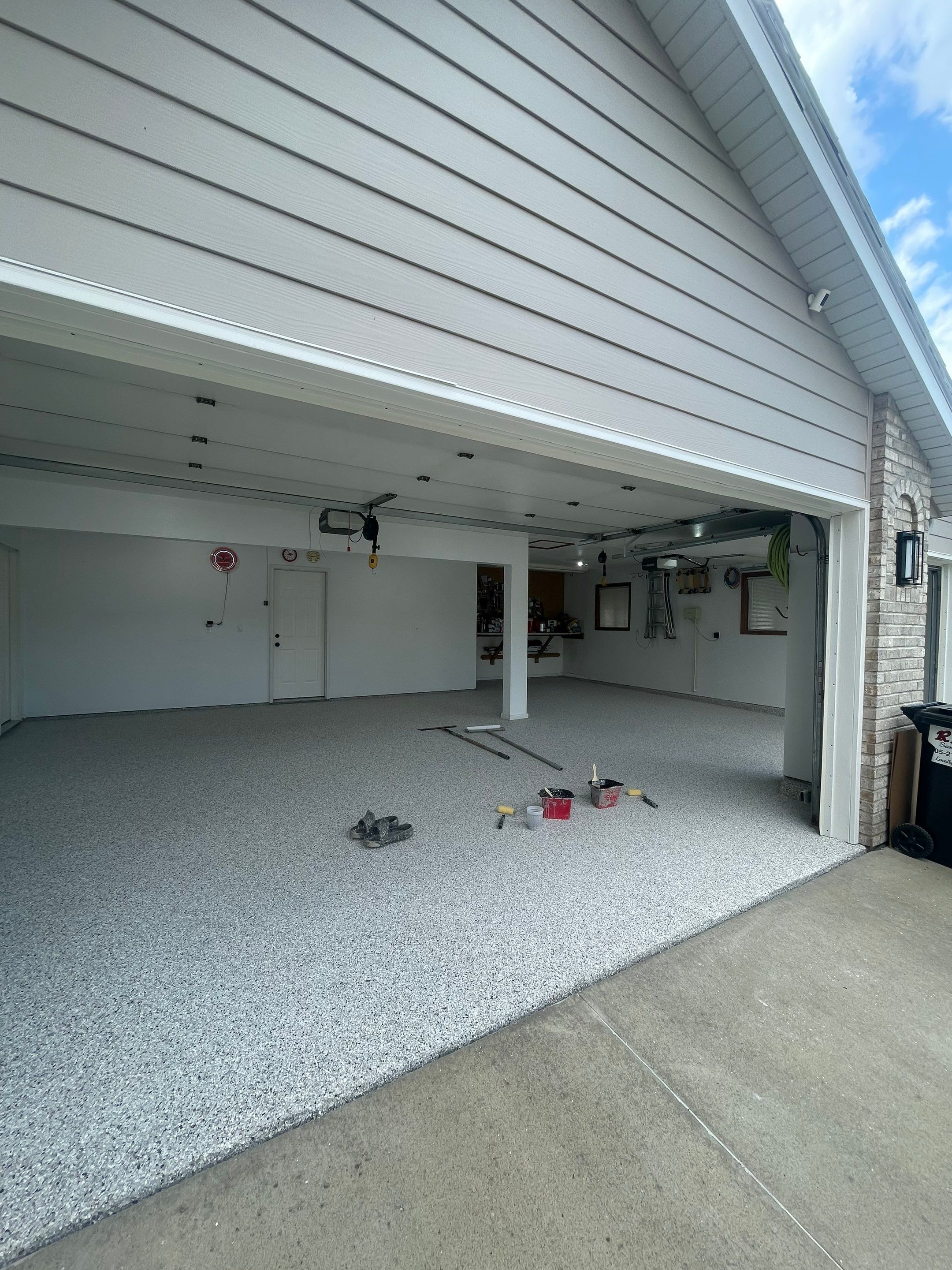 Multi-Car Garage Concrete Coating with Coyote Flake Finish in Sioux Falls by Select Painting, Coatings & Garage Cabinets