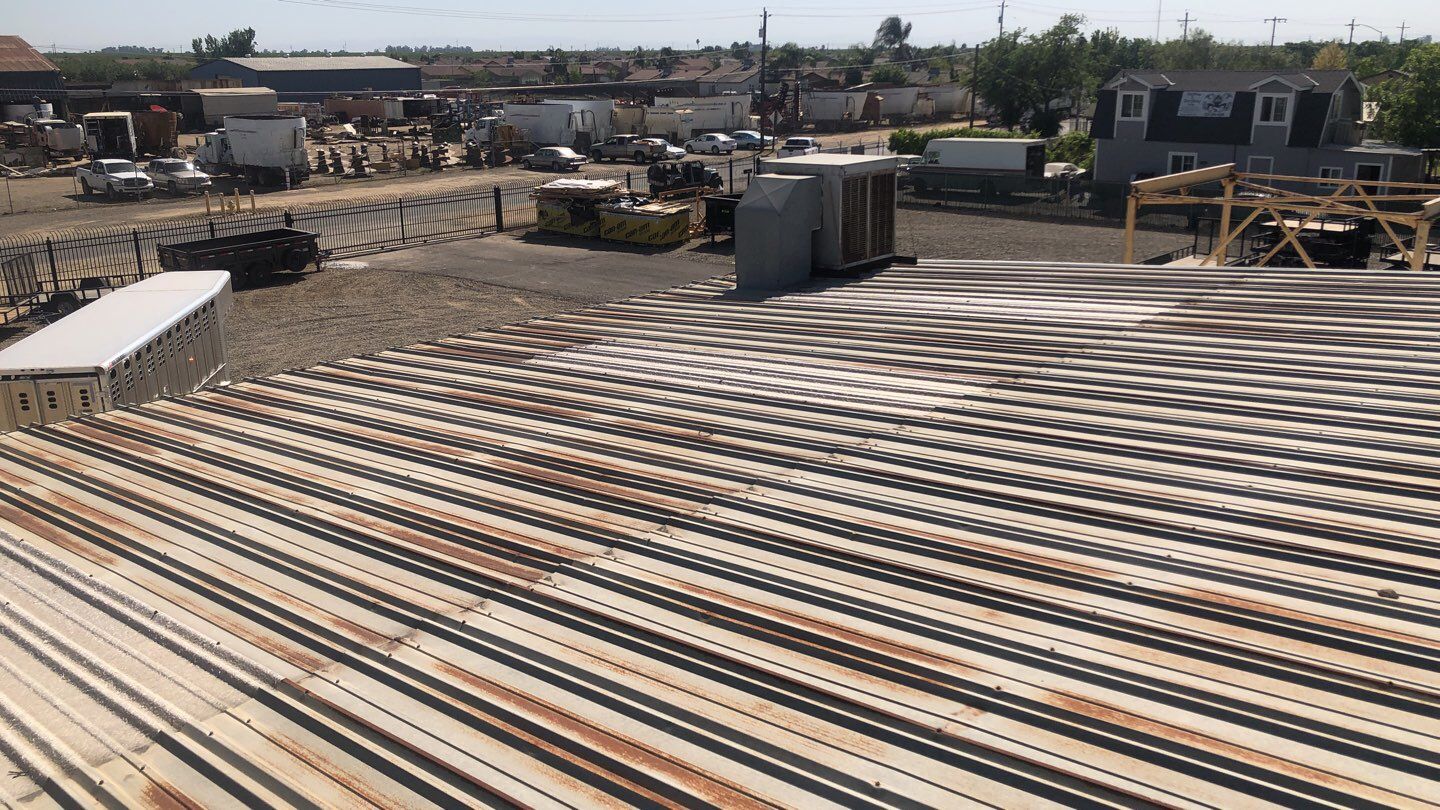 Metal Restoration Roofing system with Benchmark/PUMA XL 20 yr warranty by Straight Edge Roofing Inc