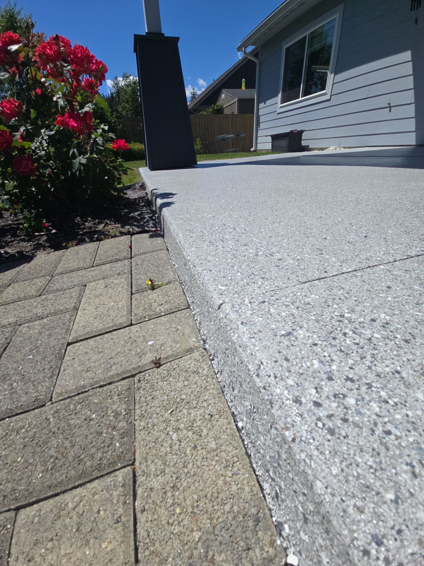 Sandpoint Patio Transformation With Agate And Battleship Hybrid Coatings by Croc Coatings, LLC