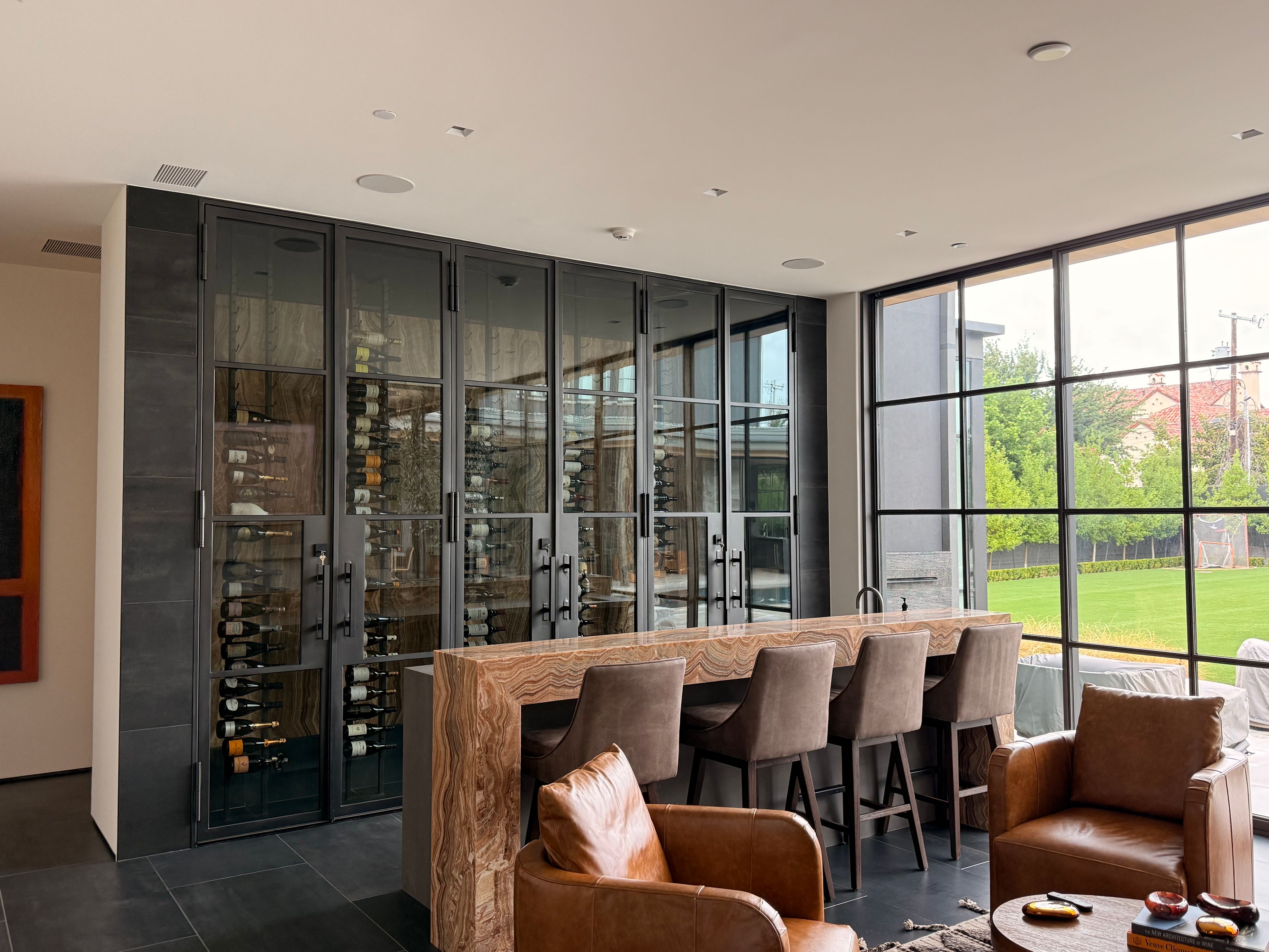 Custom Black-Framed Glass Wine Cellar Installation in Dallas by Solara Custom Living