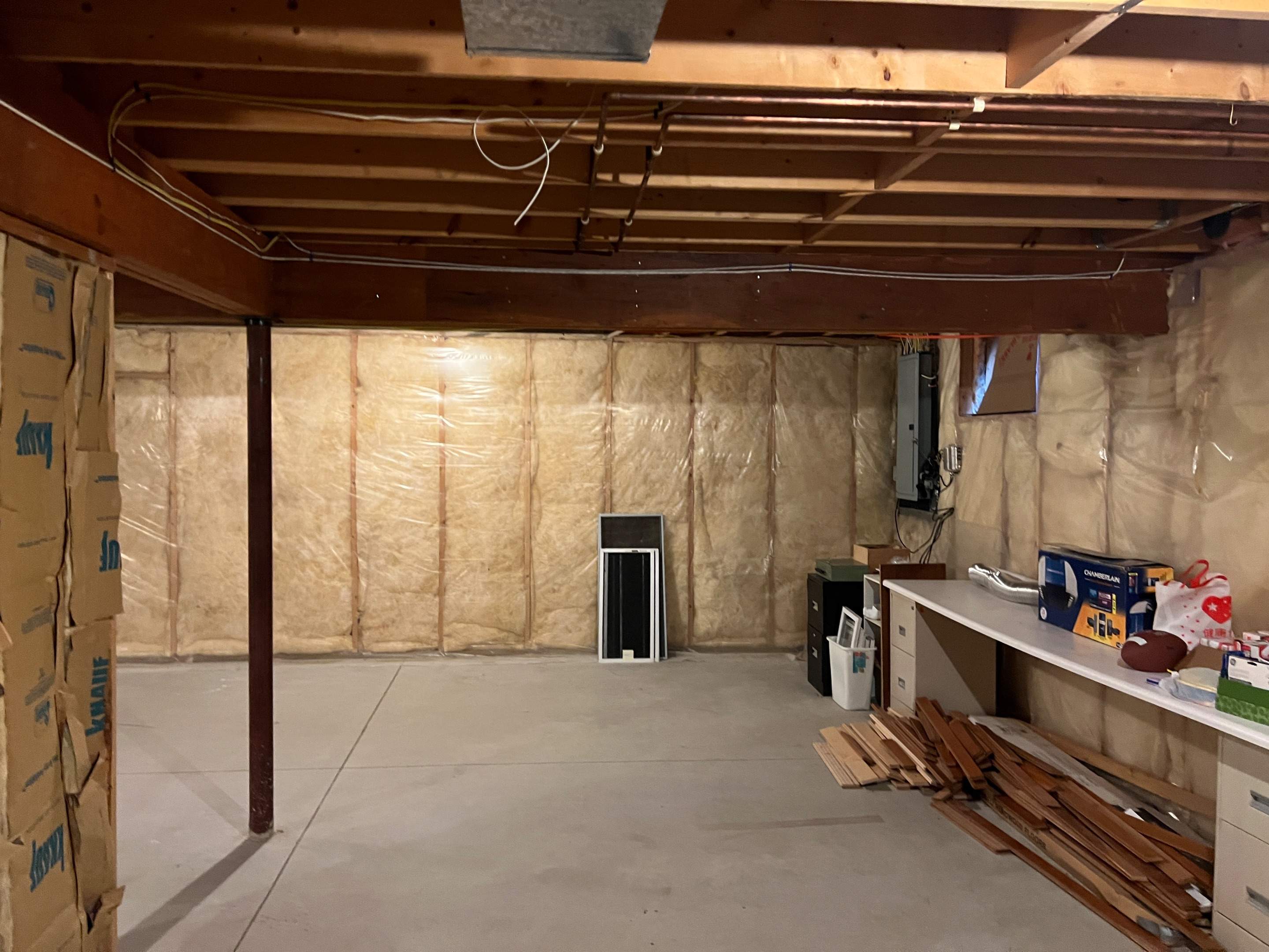 Basement Remodel w/ LVP Flooring & Exposed Ceiling by Chagnon Building & Remodeling LLC