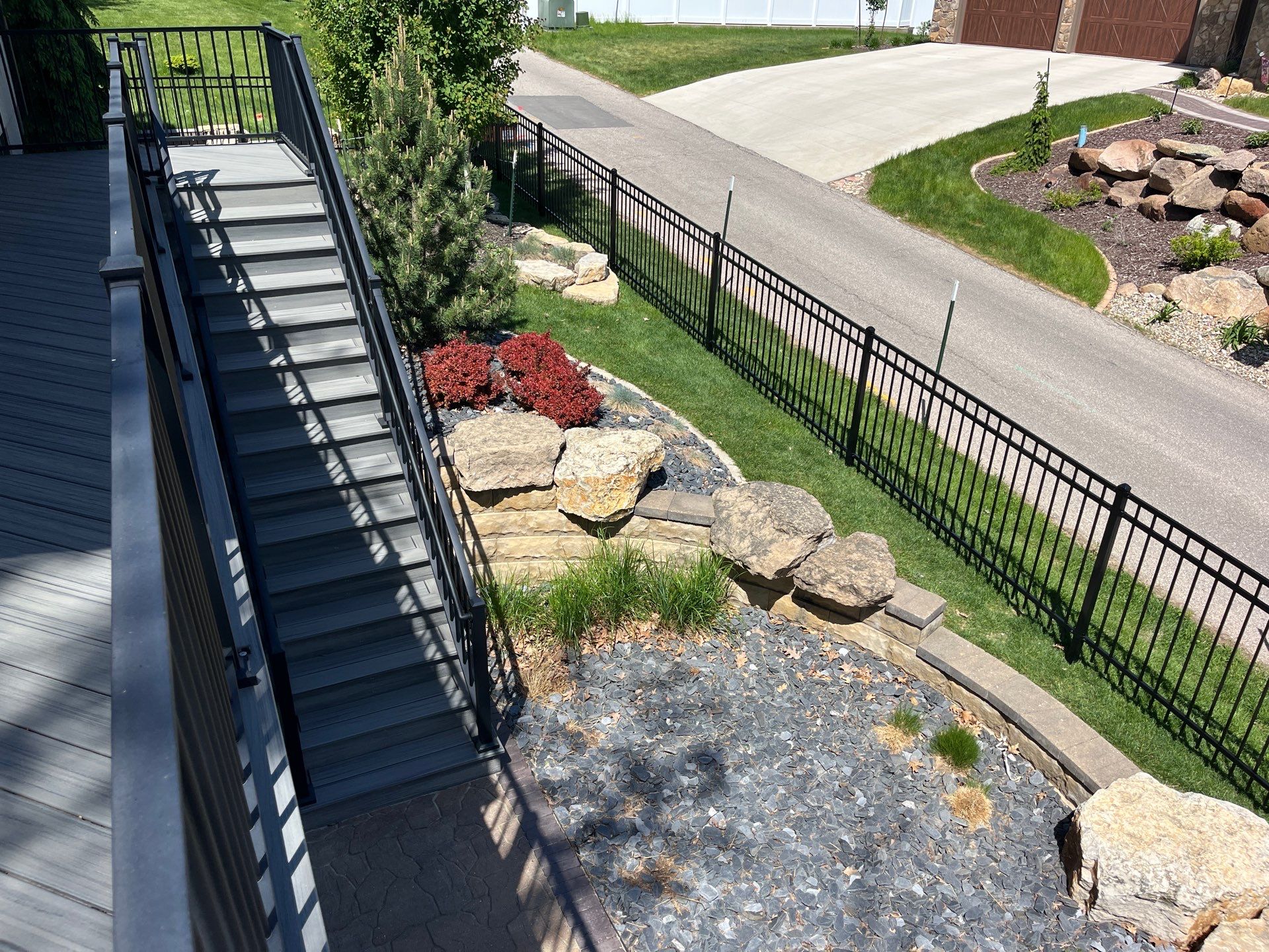 Ornamental Black Metal Picket Fence Installation in Cedar Falls by Perfect Picket Fence and Stain