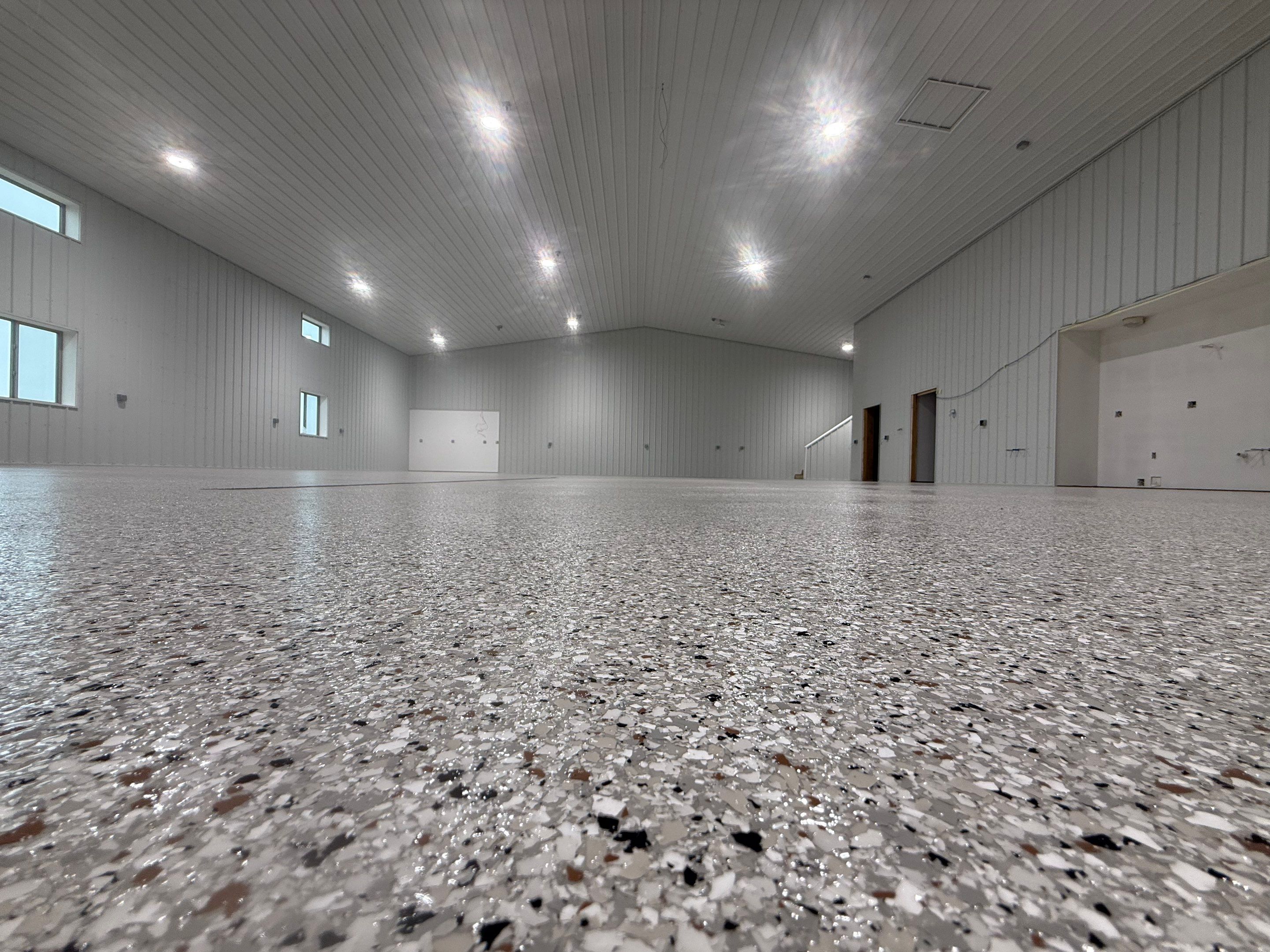 Custom Speckled Floor Coating for Large Montrose Shop by Select Painting, Coatings & Garage Cabinets