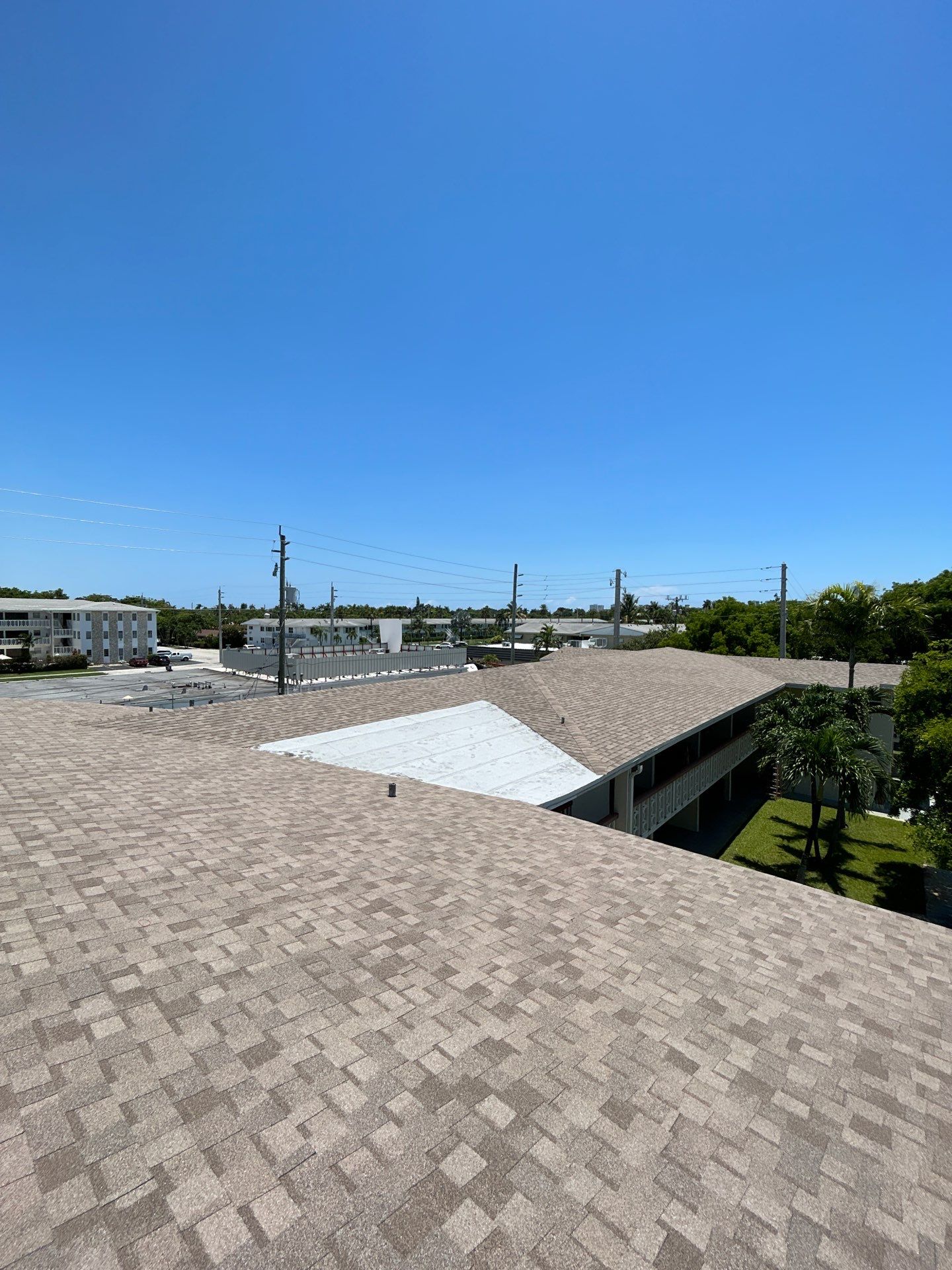Commercial Roofing Installation using CERTAINTEED LANDMARK AR (SUNRISE CEDAR) by Earl W. Johnston Roofing 