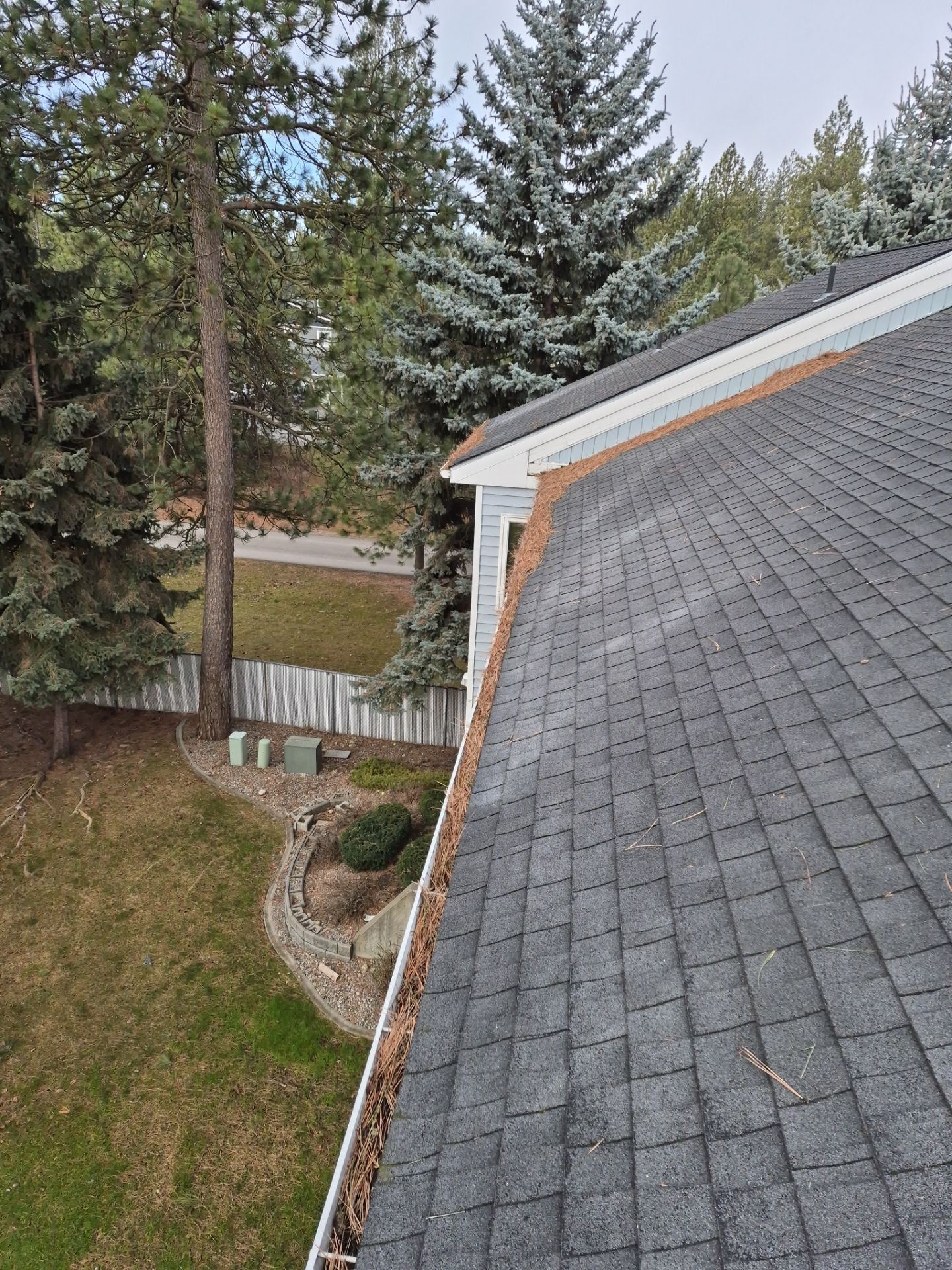 Commercial gutter cleaning Missoula, MT before photo with filled gutters
