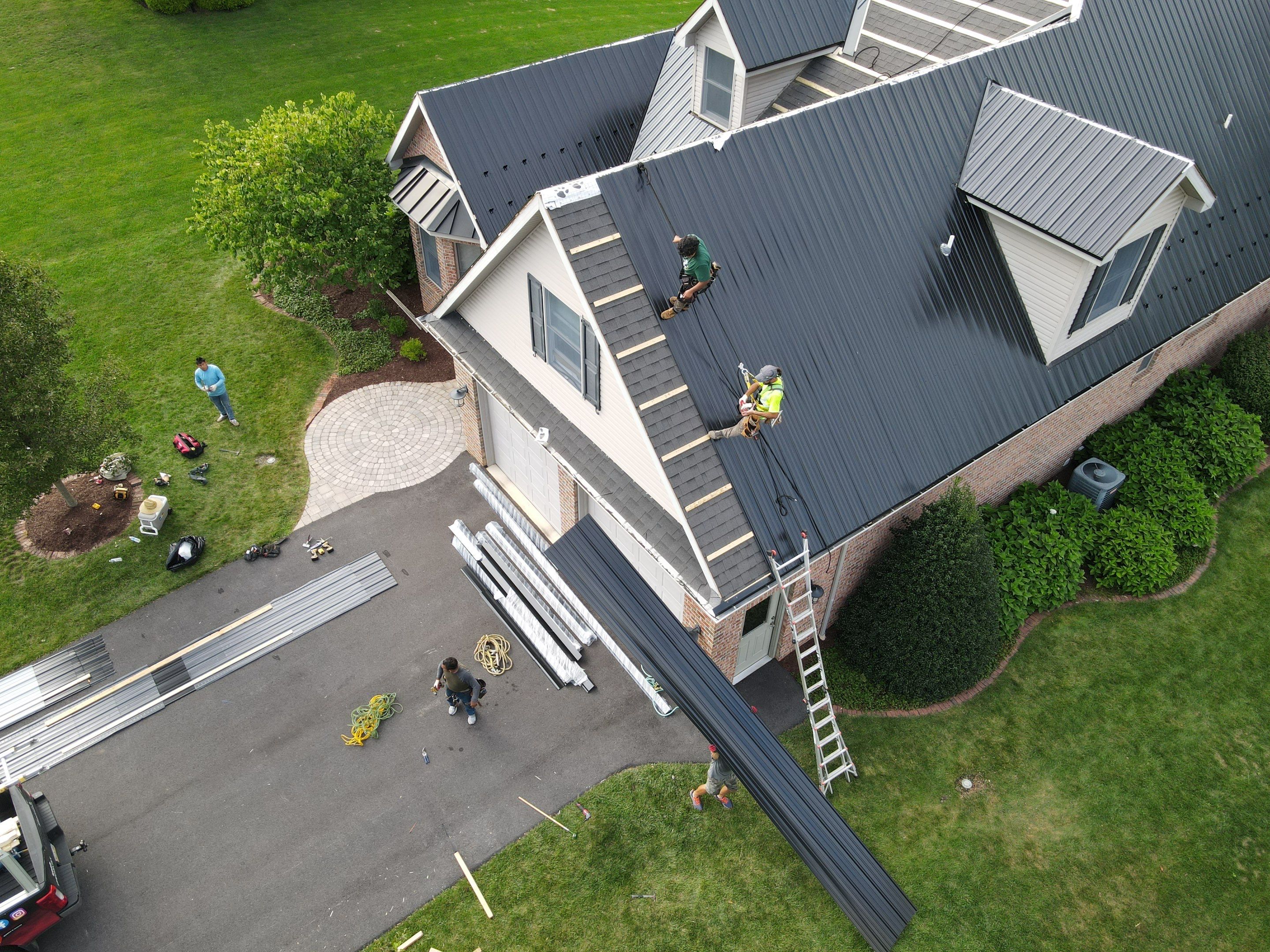 Standing seam / Azm panel in black  by Teflon Roofing