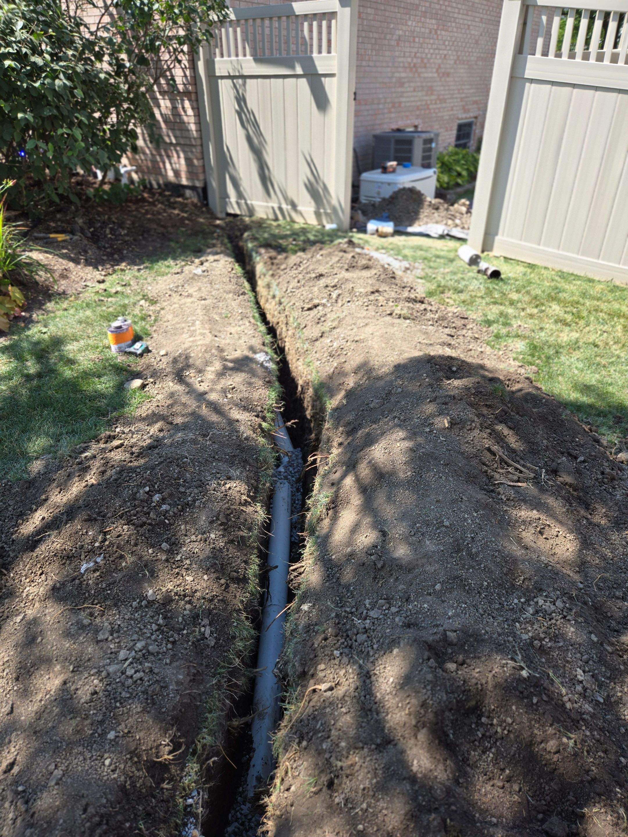 Burial of Sump Pump and Down Spout Discharges and Partial Waterproofing of Wall by Allied Water Services