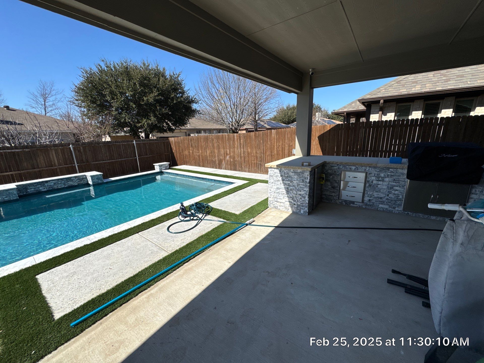 Geometric Pool with Raised Water Feature Wall and Turf by Pinnacle Pools and Spas - DFW