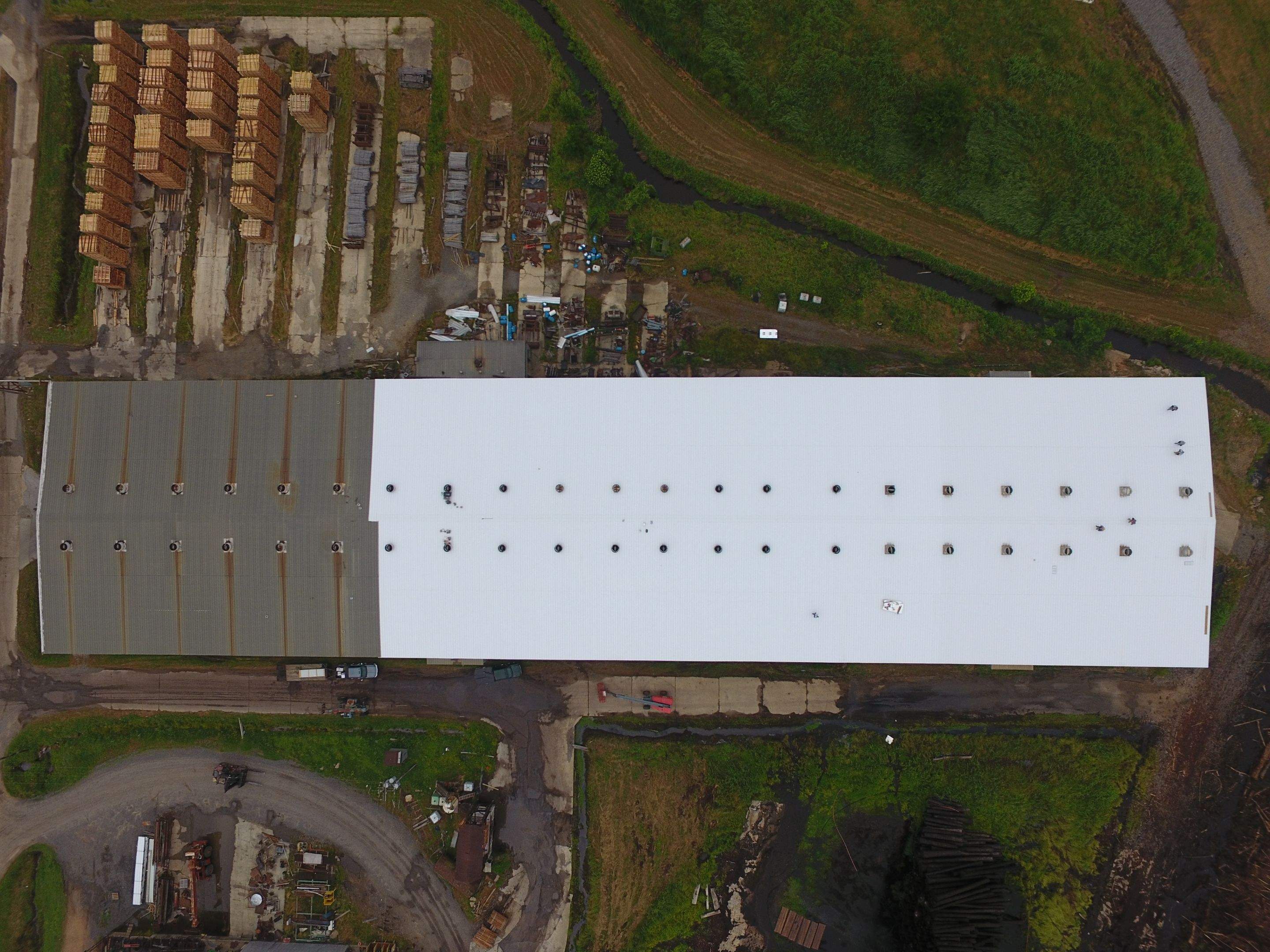 Commercial Roofing Installation using Aluminum Roofing panels by Hostetler Roofing