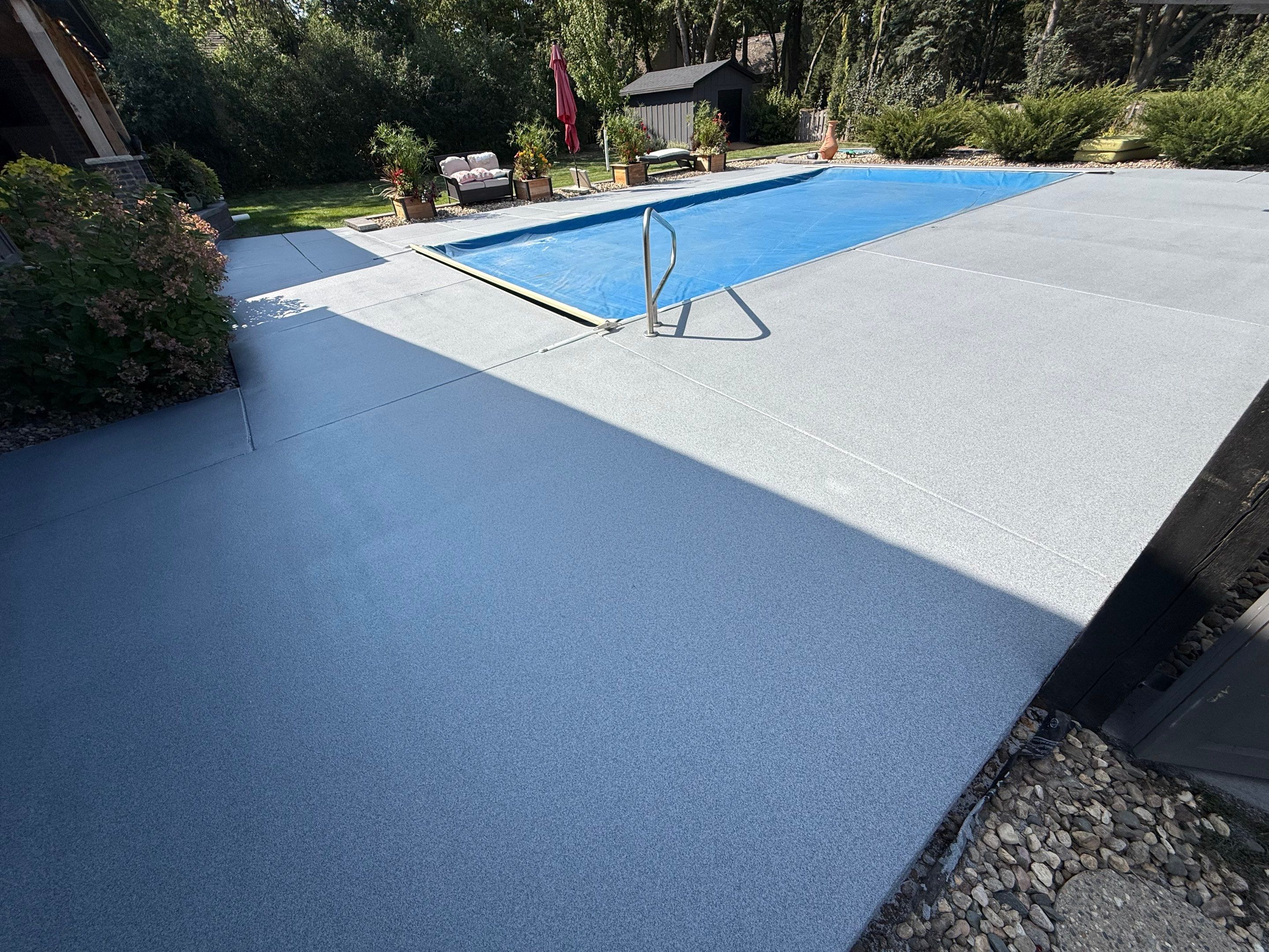 Garage Floor and Textured Pool Deck Coating in Sioux Falls by Select Painting, Coatings & Garage Cabinets