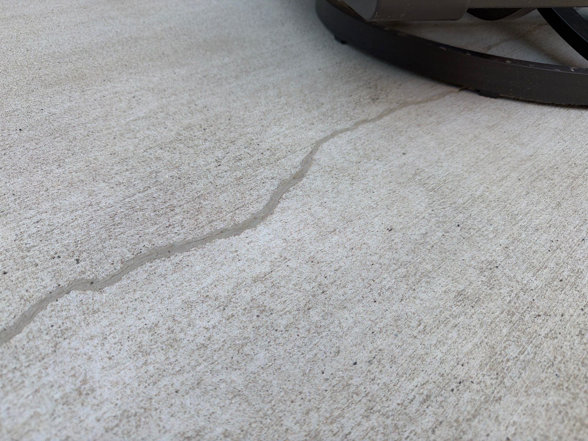 Textured Concrete Patio Coating and Custom Privacy Pergola in Sioux Falls by Select Painting, Coatings & Garage Cabinets