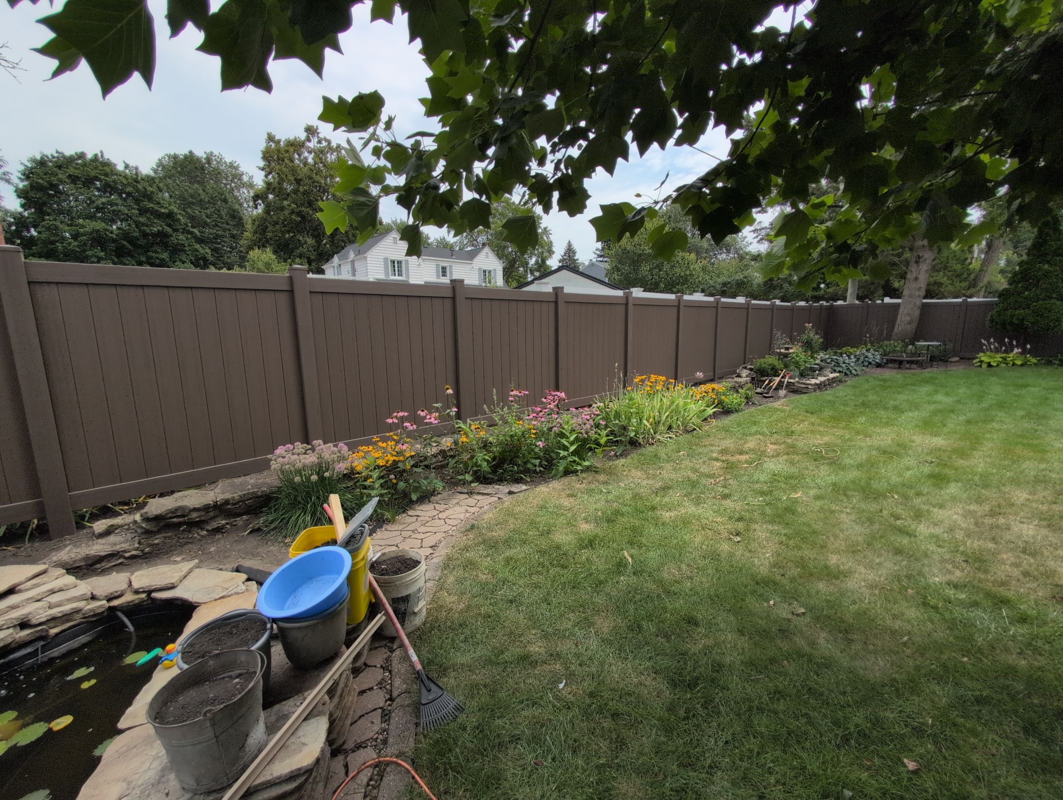 Walnut Vinyl Privacy Fence Installation in Waterloo by Perfect Picket Fence and Stain