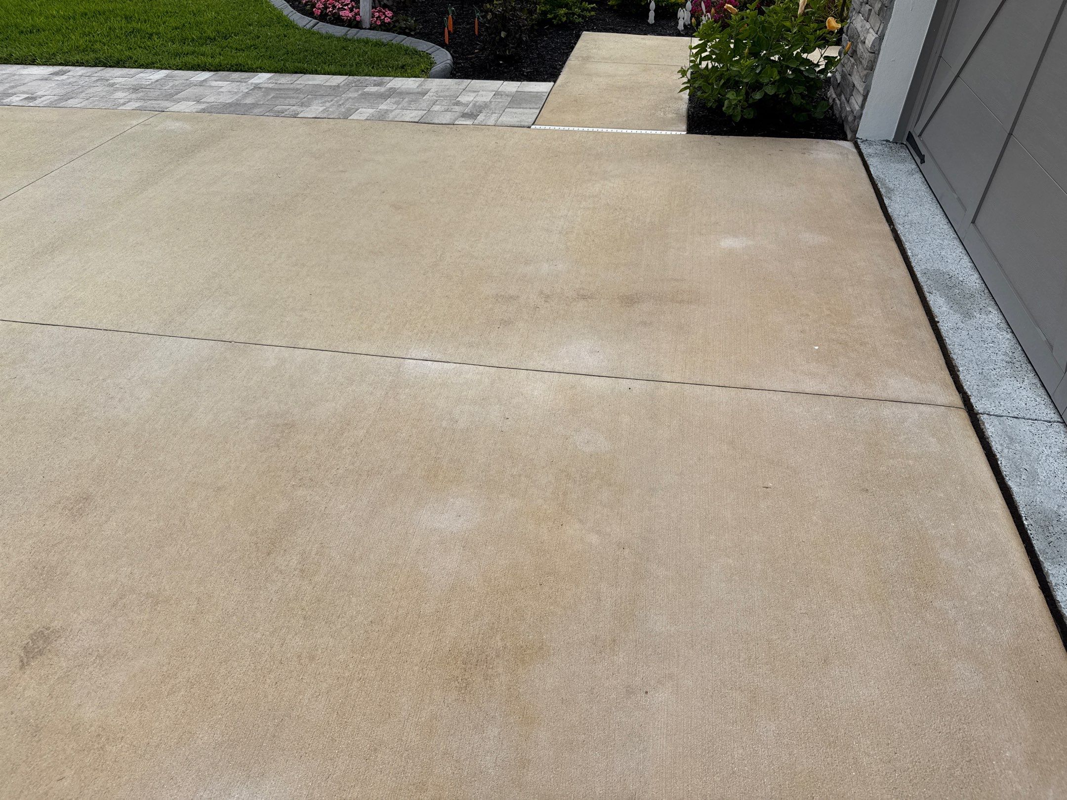 Rust Stain Removal from Concrete Driveway and Pavers in Park East at Azario | Lakewood Ranch, FL by Sunshine AquaWash